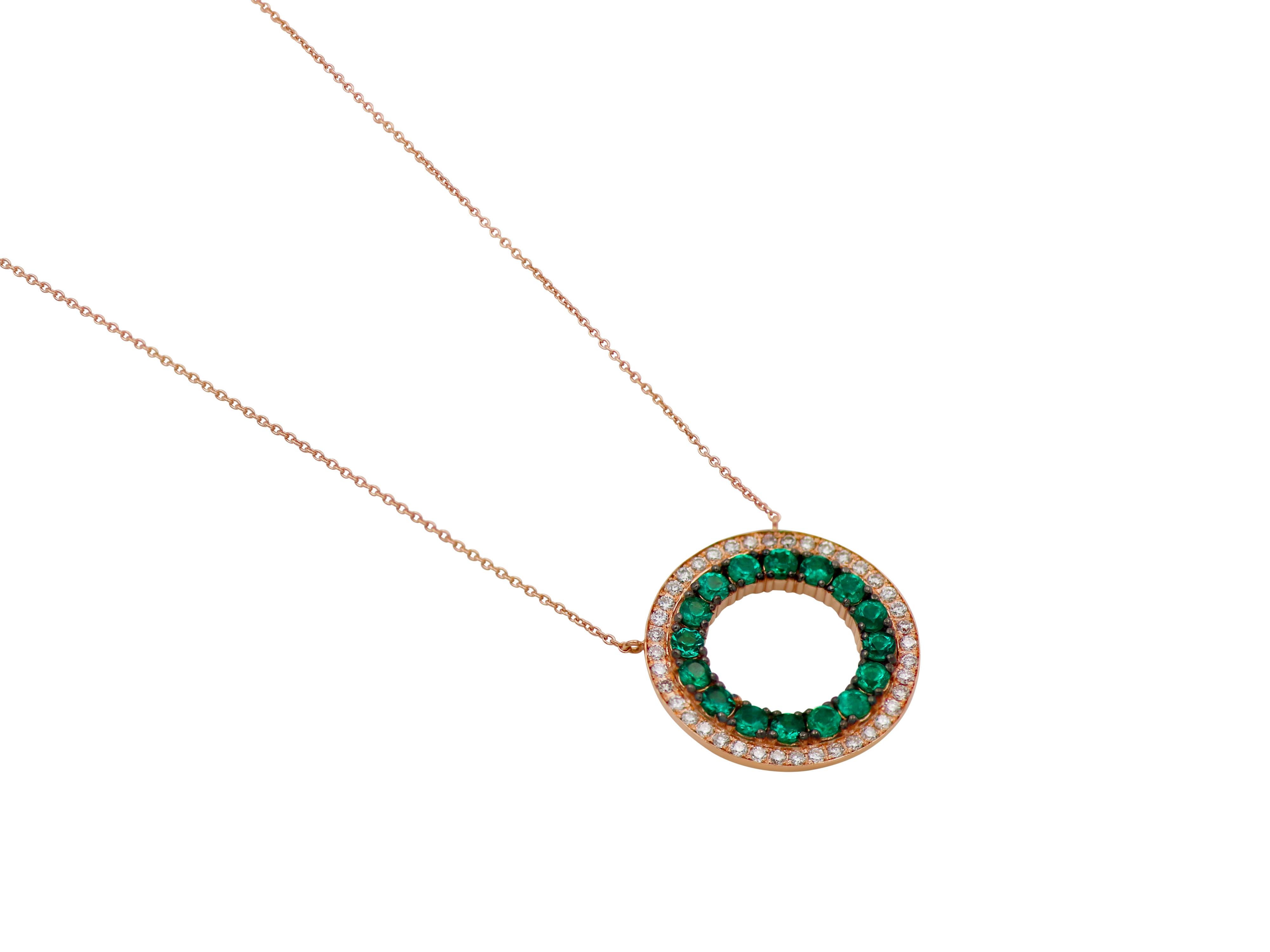 Round pendant in necklace set in 18k rose gold with 0.82 carats round cut emeralds and 0.34 carats brilliant cut diamonds