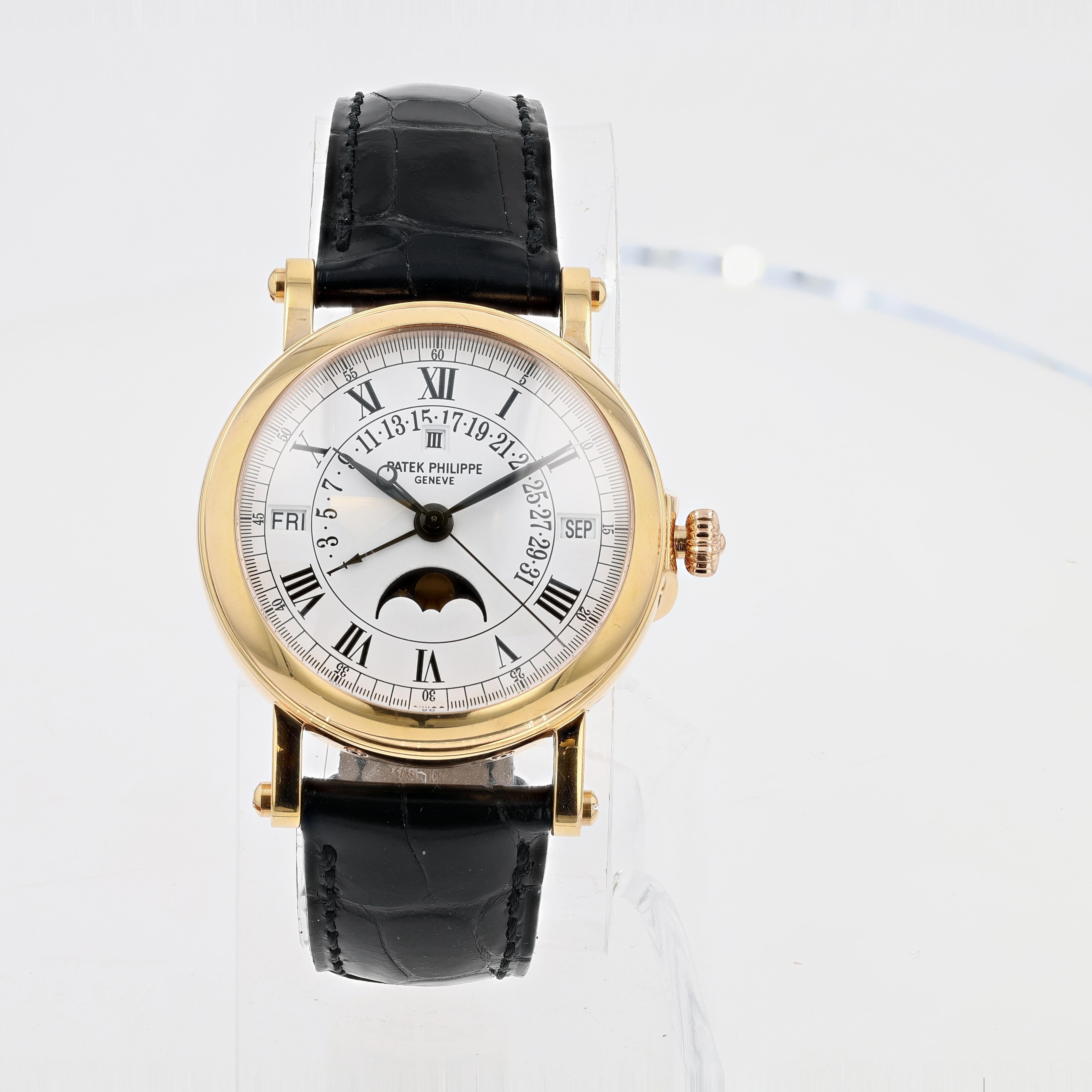 18K Rose Gold PATEK PHILIPPE PERPETUAL CALENDAR, REF#5059R-0001. The watch features 36mm case with white dial. Complications include Day, Date, Month, Moonphase, Retrograde Sector for days of the month. The watch is presented on a black alligator
