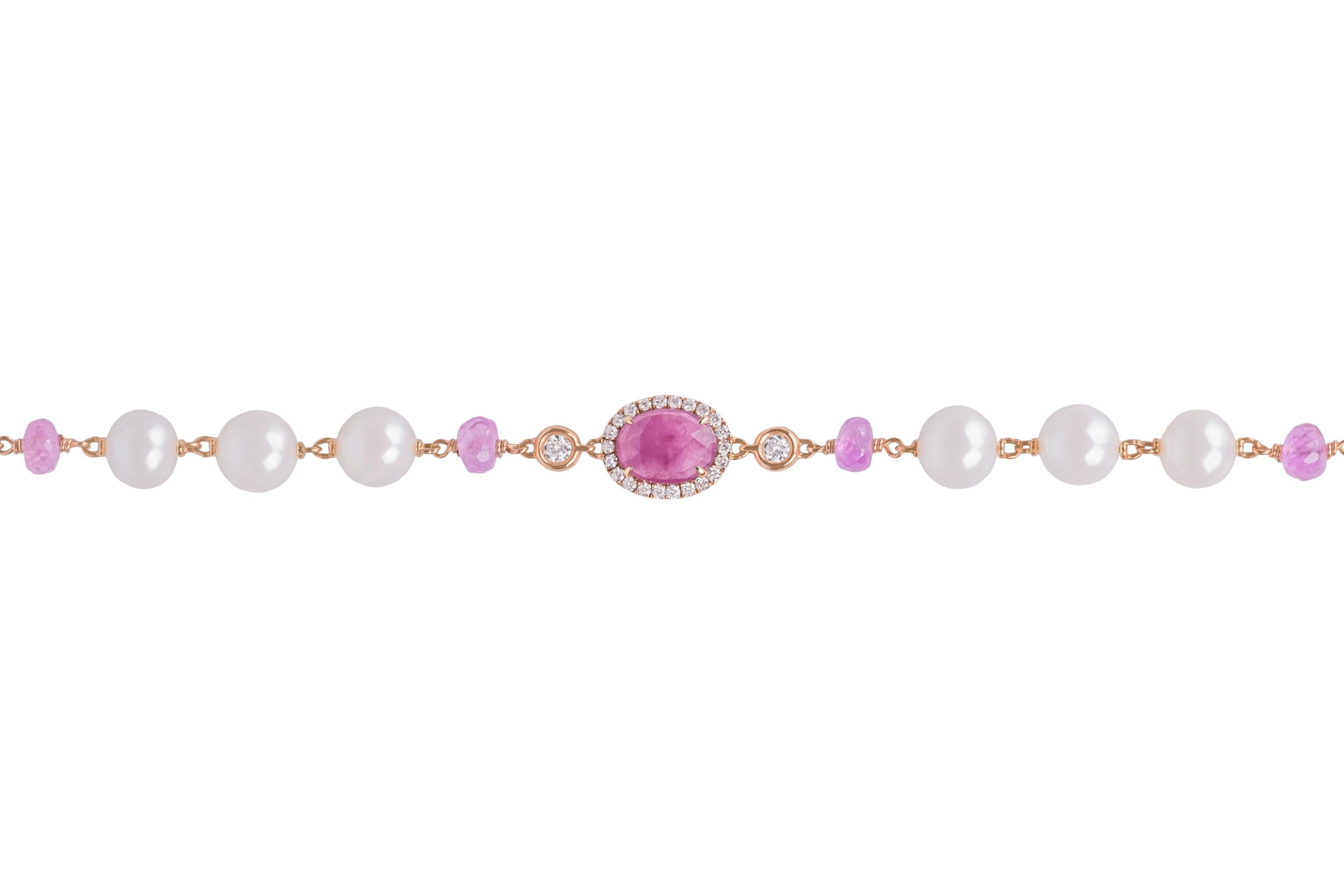 This lovely bracelet features an oval cut pink sapphire surrounded by brilliant cut diamonds, 3 pearls, 2 pink briolette cut sapphires and 2 brilliant-cut diamonds on each side. It is made in Italy by Crivelli.
This bracelet has a lobster claw and