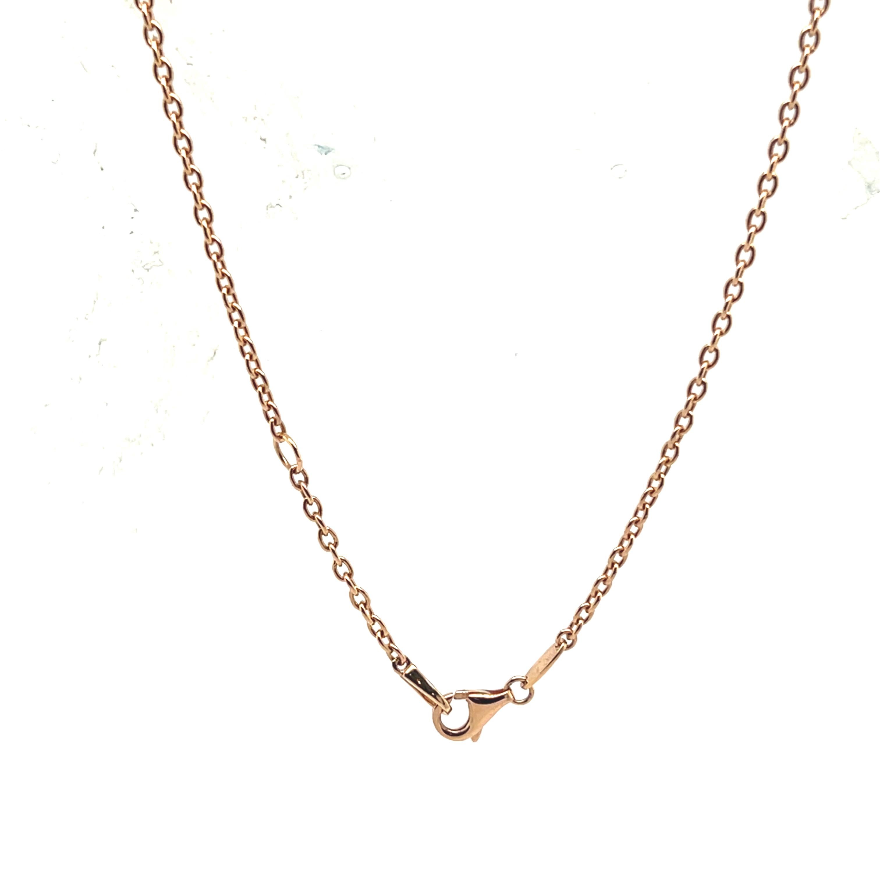 18k Rose Gold Pendant with Cabochon Emerald and Diamonds

A 18-karat rose gold pendant featuring a natural Zambian emerald, cabochon-cut and mounted in a drop shape. The center stone, a deep, intense green, is enhanced by an elegant halo of 33