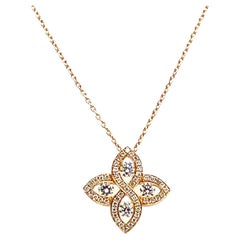 18K Rose Gold Pendant with Stylized Flower Motif and Diamonds