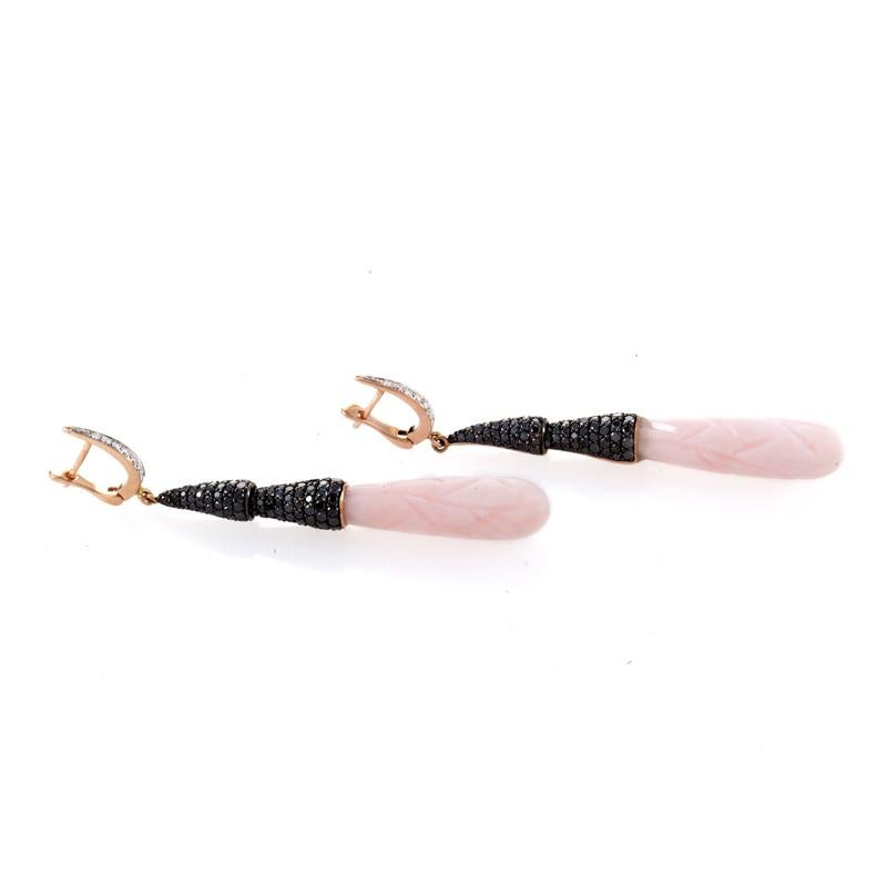 Subtle curves invoke thoughts of feminine beauty as one gazes upon the decadent design of this pair of earrings from the French Collection. The earrings are made of 18K rose gold set with a black diamond pave. Lastly, the drop of each earring is a