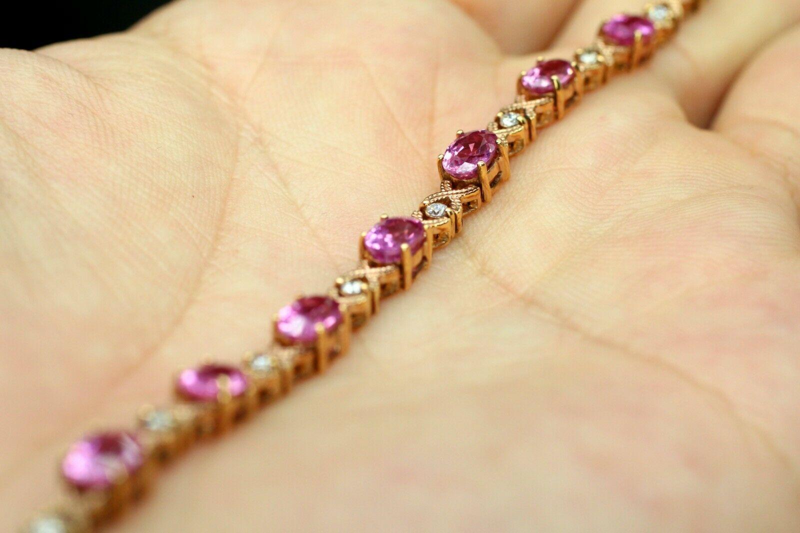  This oval pink sapphire bracelet looks stunning, arranged in 18K rose gold with 14 pieces of round cut diamonds in between. 
Specifications:
    main stone: 12 PCS OVAL PINK SAPPHIRE 6X4.22MM 
    diamonds: 14 PCS ROUND DIAM APPROX 0.29CTW   
   