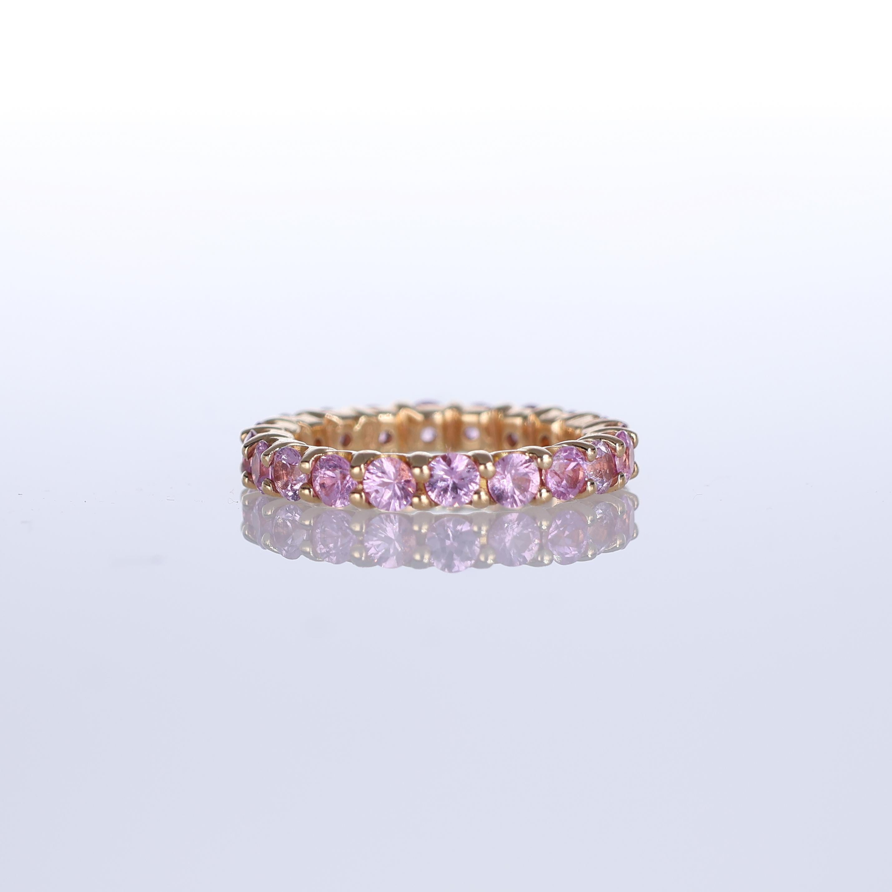 A refined eternity band crafted in 18K rose gold, featuring 3.68 carats of exquisite pink sapphires. The warm tones of the gold beautifully complement the soft yet vibrant hue of the sapphires, creating an elegant and feminine piece. Designed for