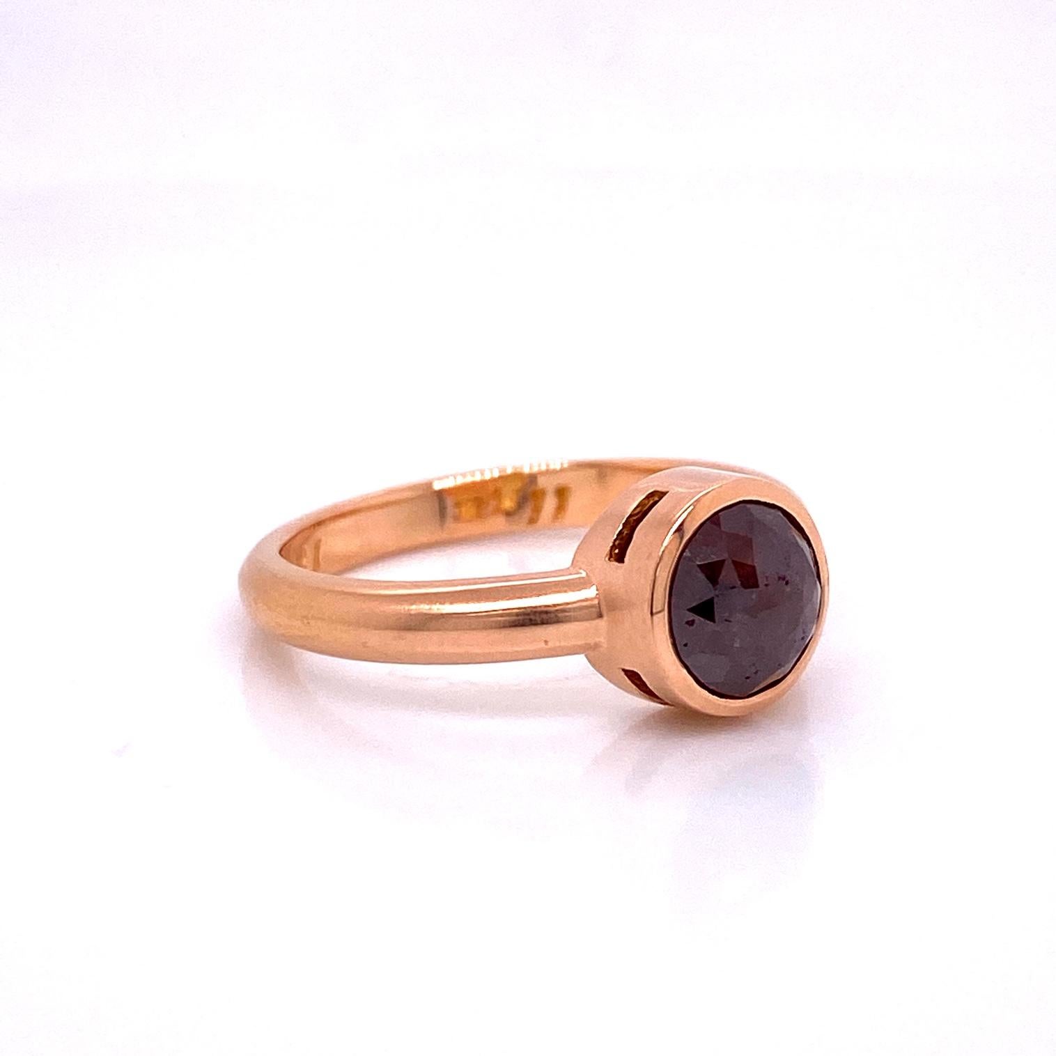 An 18k rose gold ring bezel set with a 3.12 carat round red brown rose cut diamond with a brushed finish. Ring size 7. Designed and made by llyn strong.