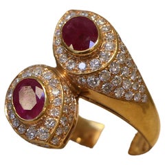 Anello in oro rosa 18K con diamanti e rubini incastonati
