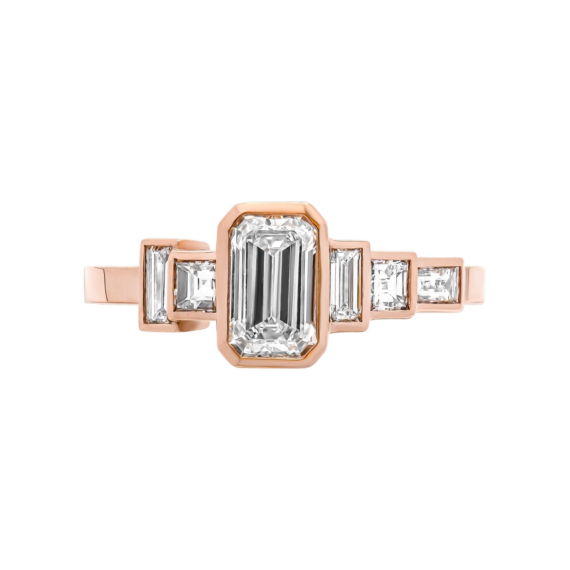 With plain shank & bezel halo with 0.80 Carat Emerald Cut Diamond Ring in 18K Rose Gold 
2 stones baguette cut diamonds 0.10ct each 3 stones princess cut diamonds 0.19ct each 
Size: 5