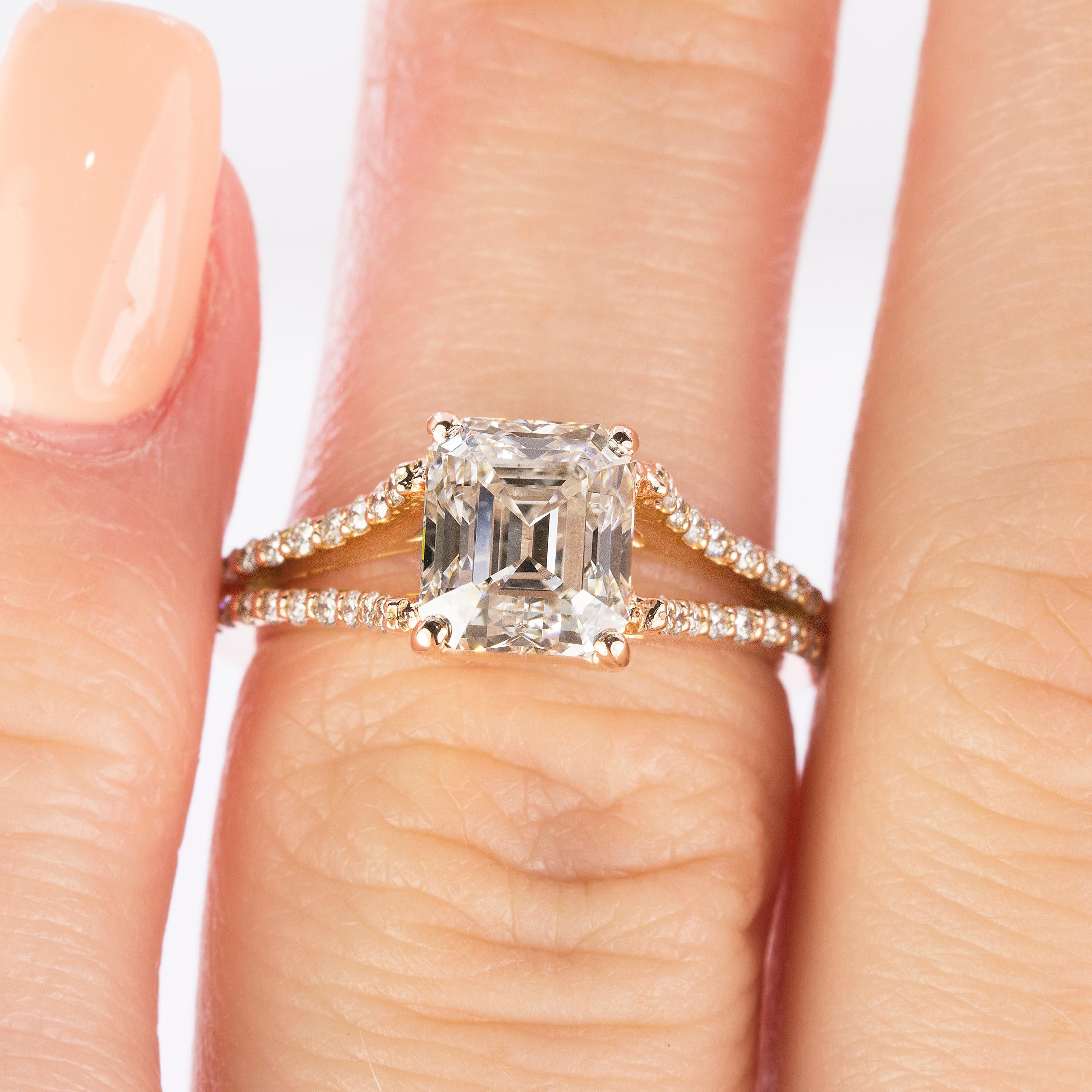 18k Rose Gold ring with one 2.02 carat GIA certified K color VS2 clarity emerald cut diamond and 40 round brilliant diamonds weighing 0.32 carats.