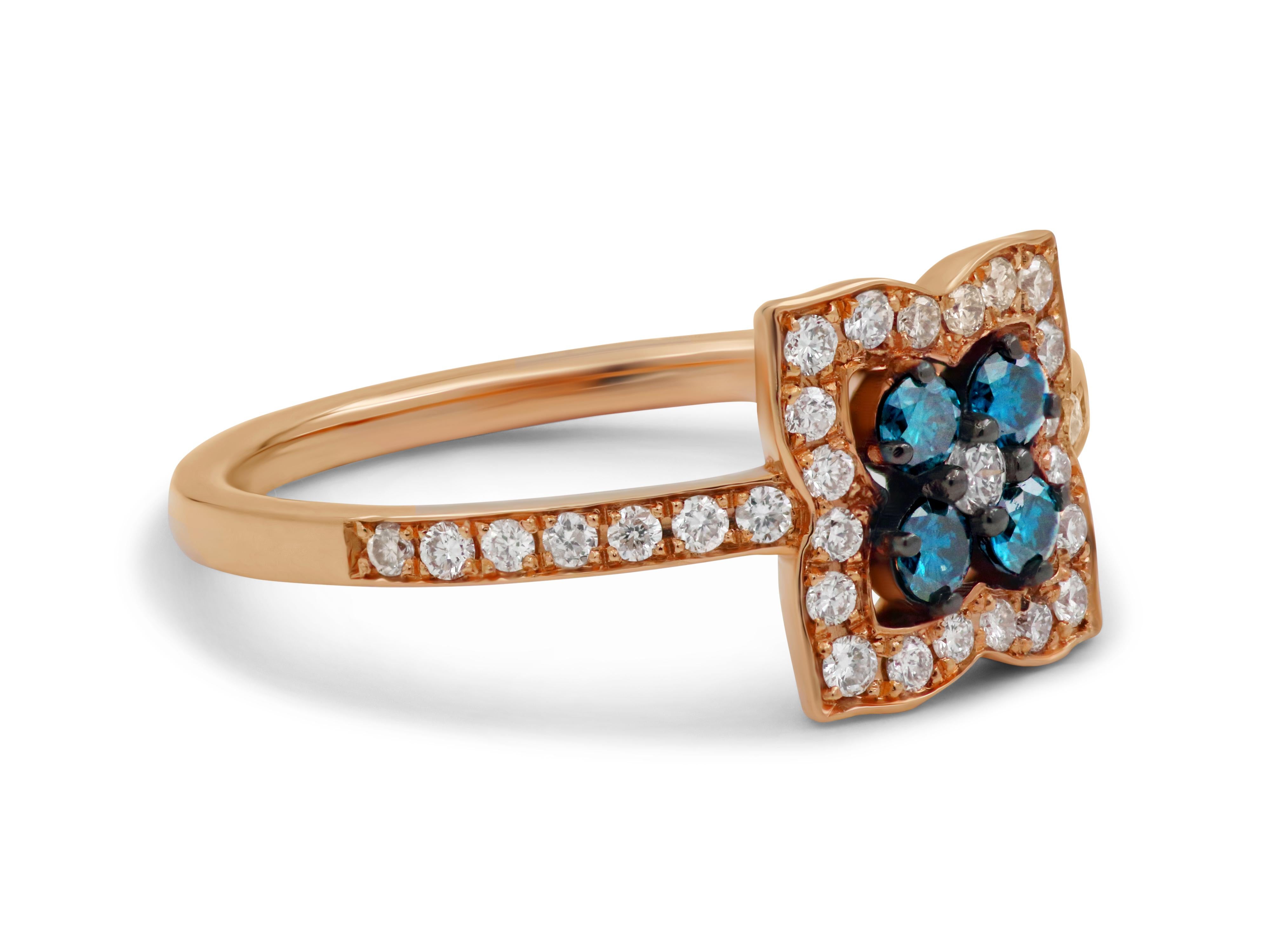 18k rose gold dainty ring with 0.16 carats blue diamonds and 0.28 carats brilliant cut diamonds.