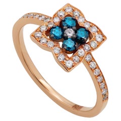 Bague en or rose 18 carats avec diamants bleus et blancs