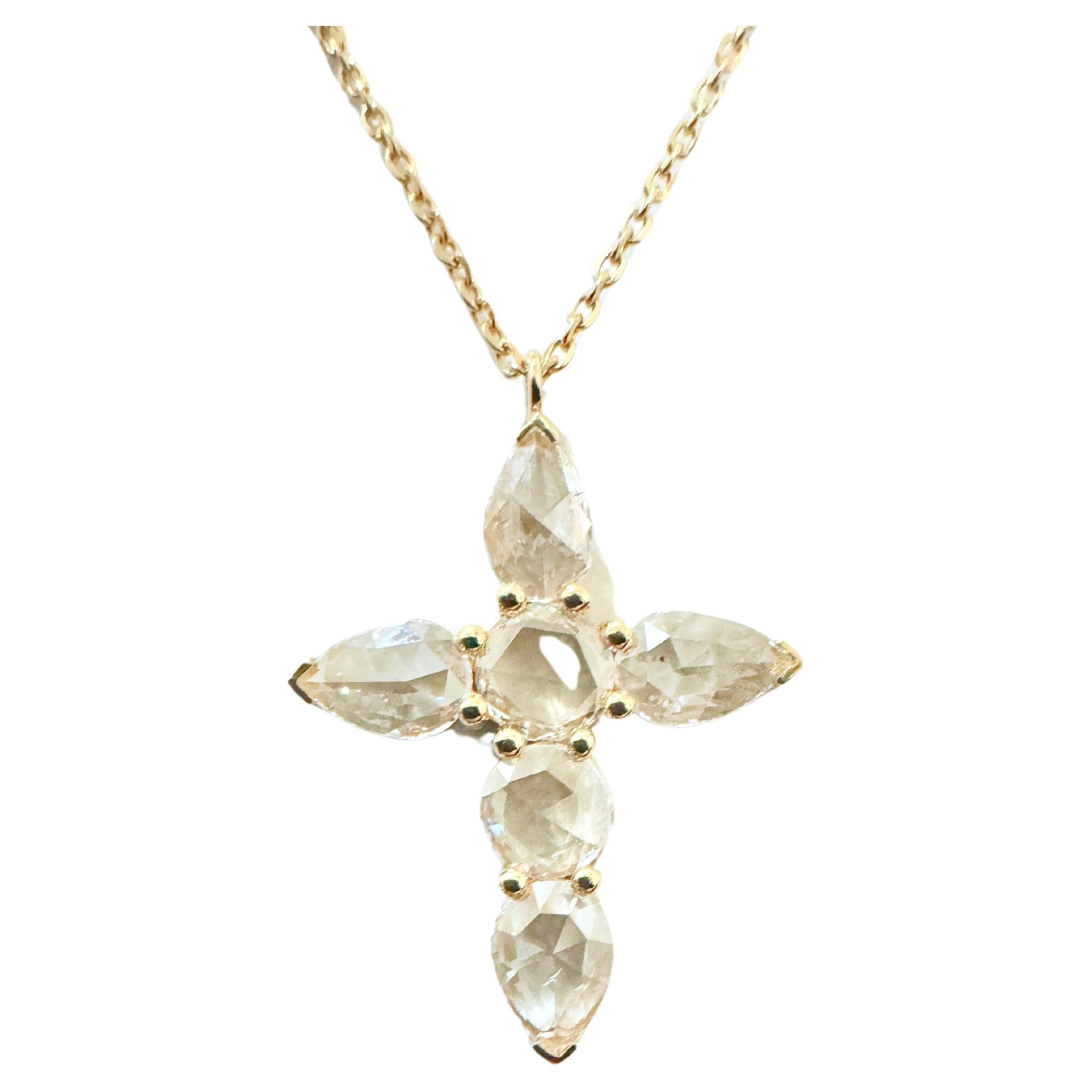 This is a piece of art.  The beautifully arranged layout of the pear shape and round shape rose cut diamonds uniquely make this diamond cross pendant an eye catcher.  The subtle glimmer of the diamonds gives it such character and will grasp