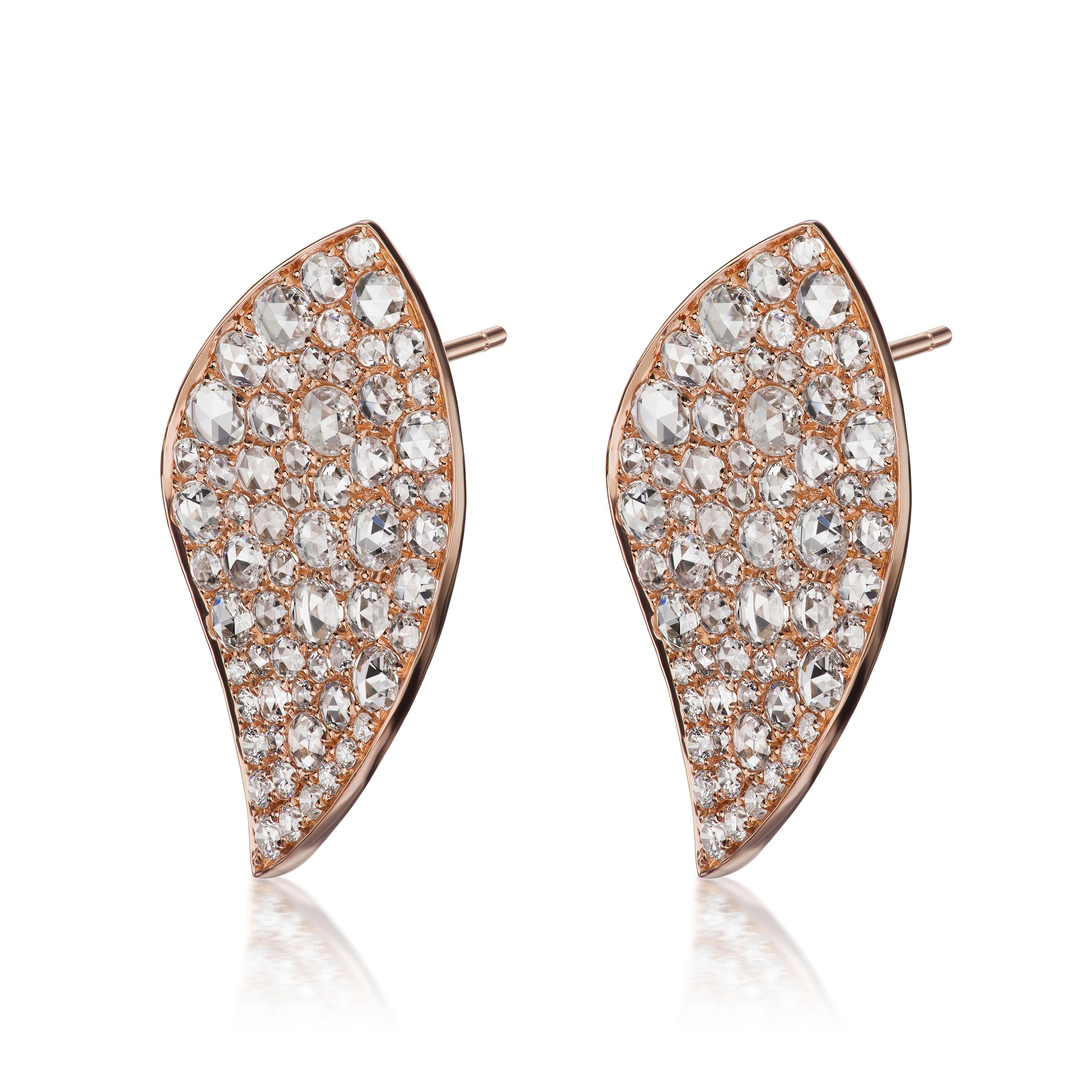 This 18 Karat rose gold  diamond stud earring in elegant frame is embellished with diamonds. Each pair is made with 18 round diamonds and 108 rose cut diamonds. They come with gold posts and clutch backs.

JEWELRY SPECIFICATION:
Approx. Metal