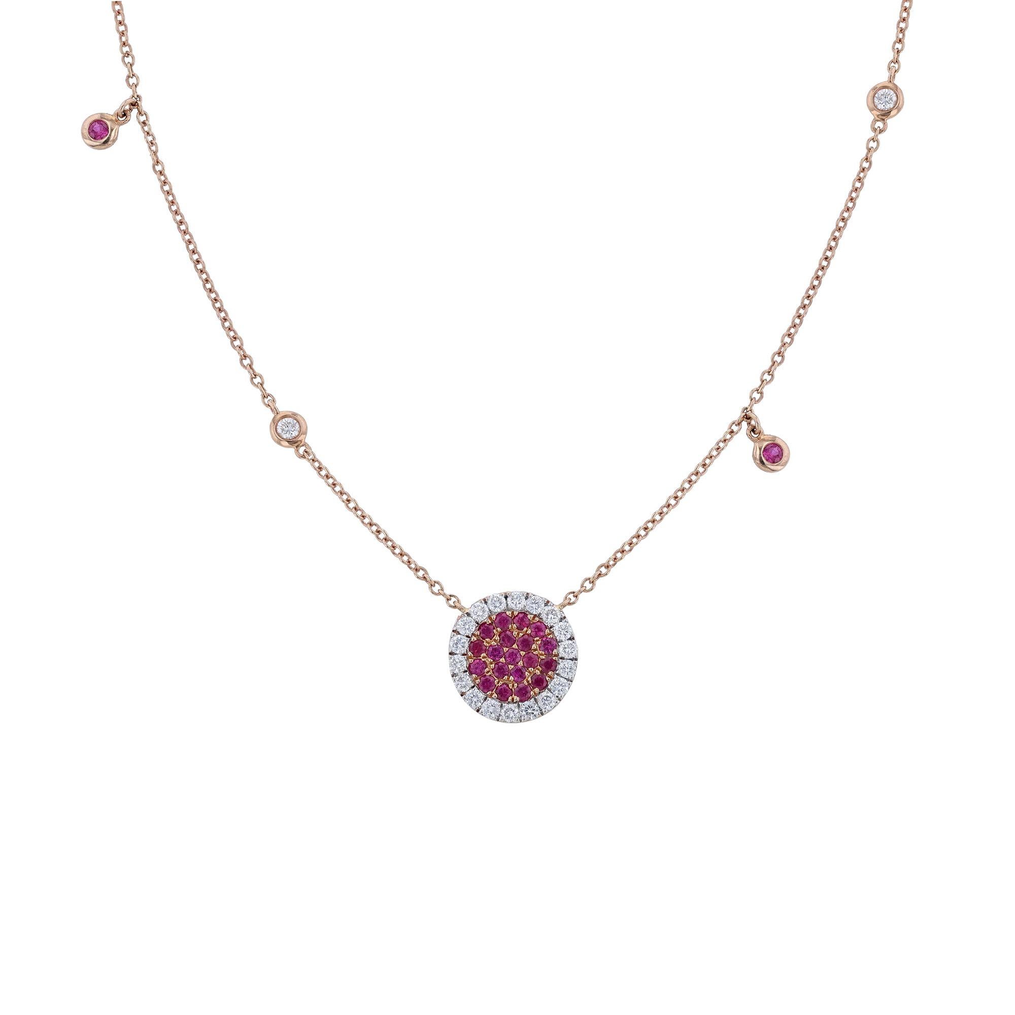 This pendant necklace is made in 18K rose gold. It features a disc shape pendant encrusted with 19 round cut, pave' set rubies. Surrounded by a halo of 18 round cut diamonds. With 2 round cut, bezel diamonds stations, and 2 ruby bezel charms. The