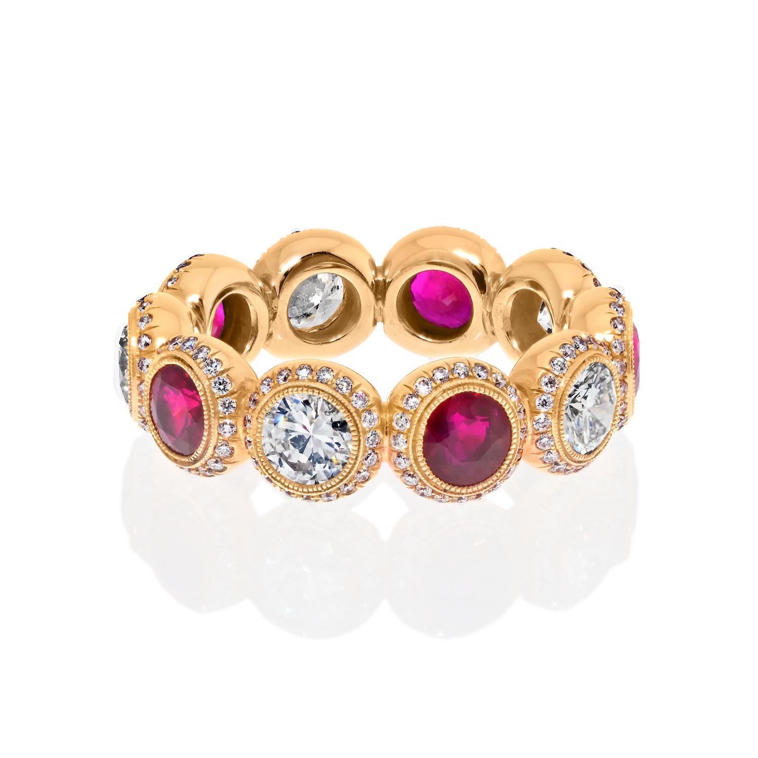Introducing our stunning handmade ruby and diamond eternity band, crafted in 18K Gold with unparalleled attention to detail. This breathtaking ring is made from 18k yellow gold and features a mesmerizing combination of rubies and diamonds that
