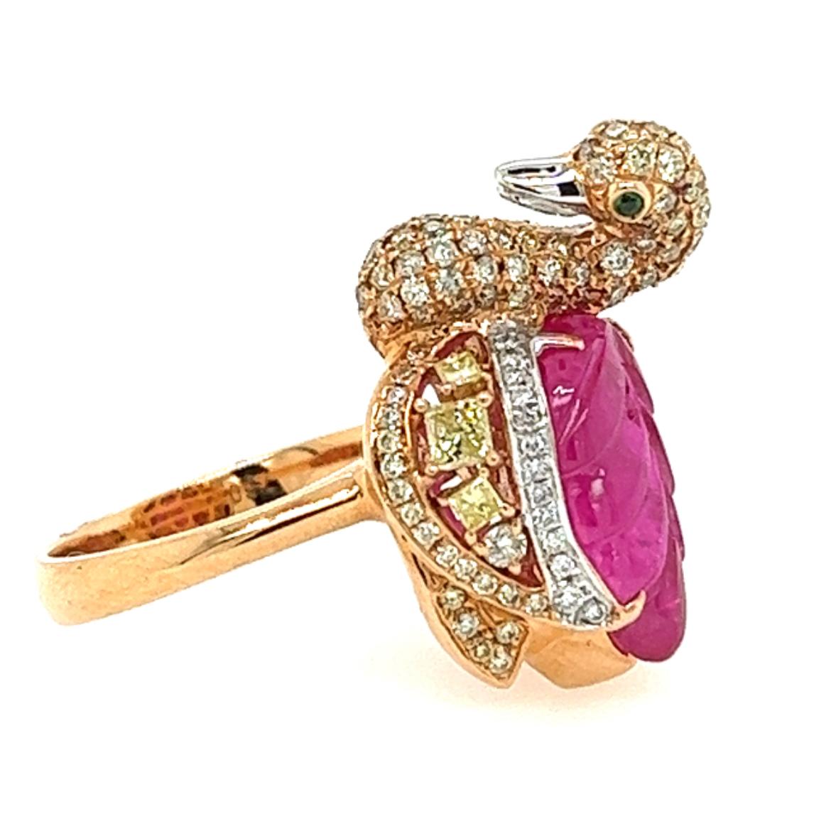 18K Rose Gold Ruby Swan Ring with Diamonds

157 Diamonds - 0.97 CT
2 Green Garnets - 0.02 CT
1 Ruby -  4.51 CT
6 Yellow Diamonds - 0.37 CT
18K Rose Gold - 7.75 GM

This captivating 18K rose gold ring features a breathtaking ruby at its center,