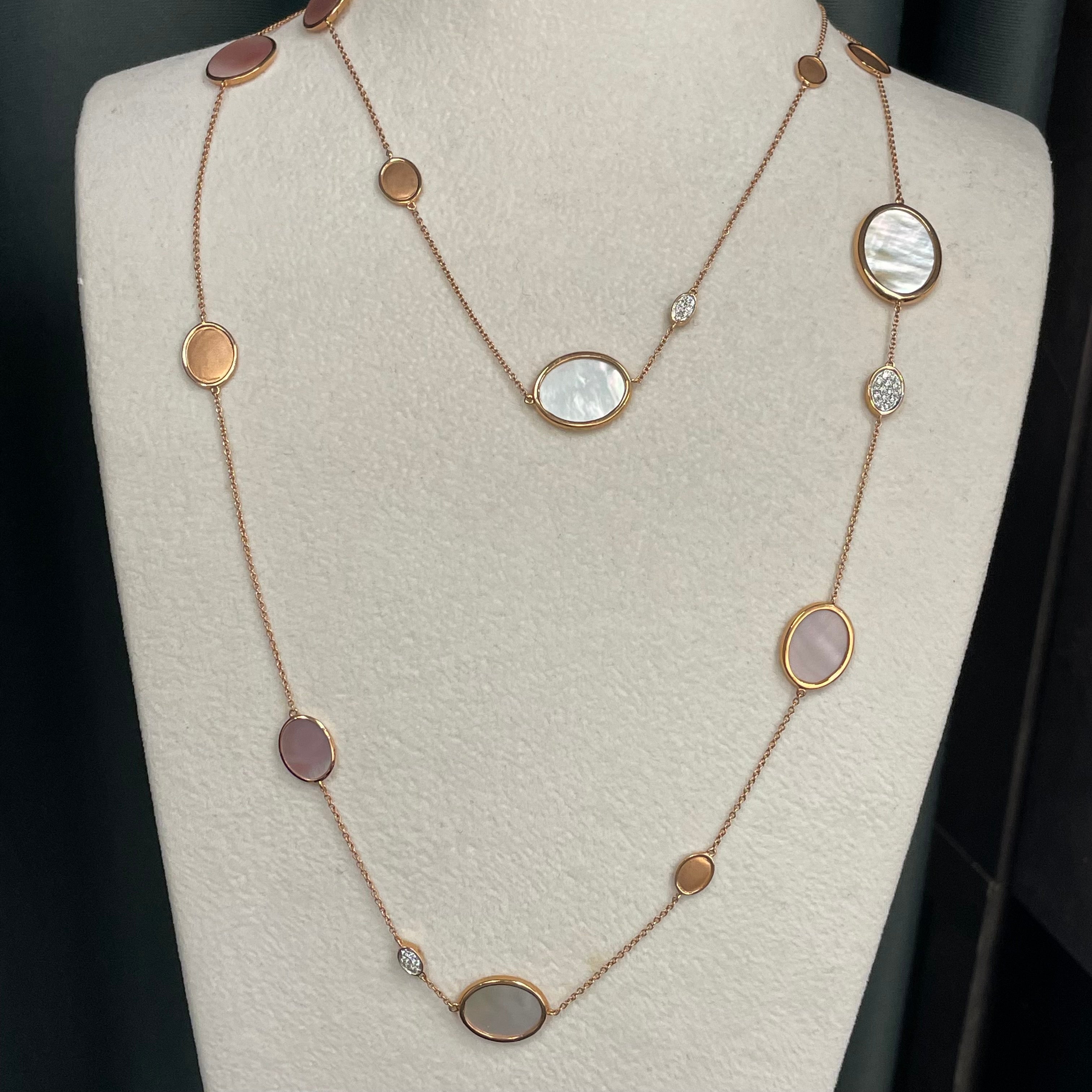 A beautiful oval shell slice with double-sided oval shape with pave diamonds setting long necklace. Totalling 19 pieces of shells, weighing 23.12 carats, 80 pieces of round brillant-cut round diamonds, weighing 0.64 carats. Made in 18K rose gold. 
