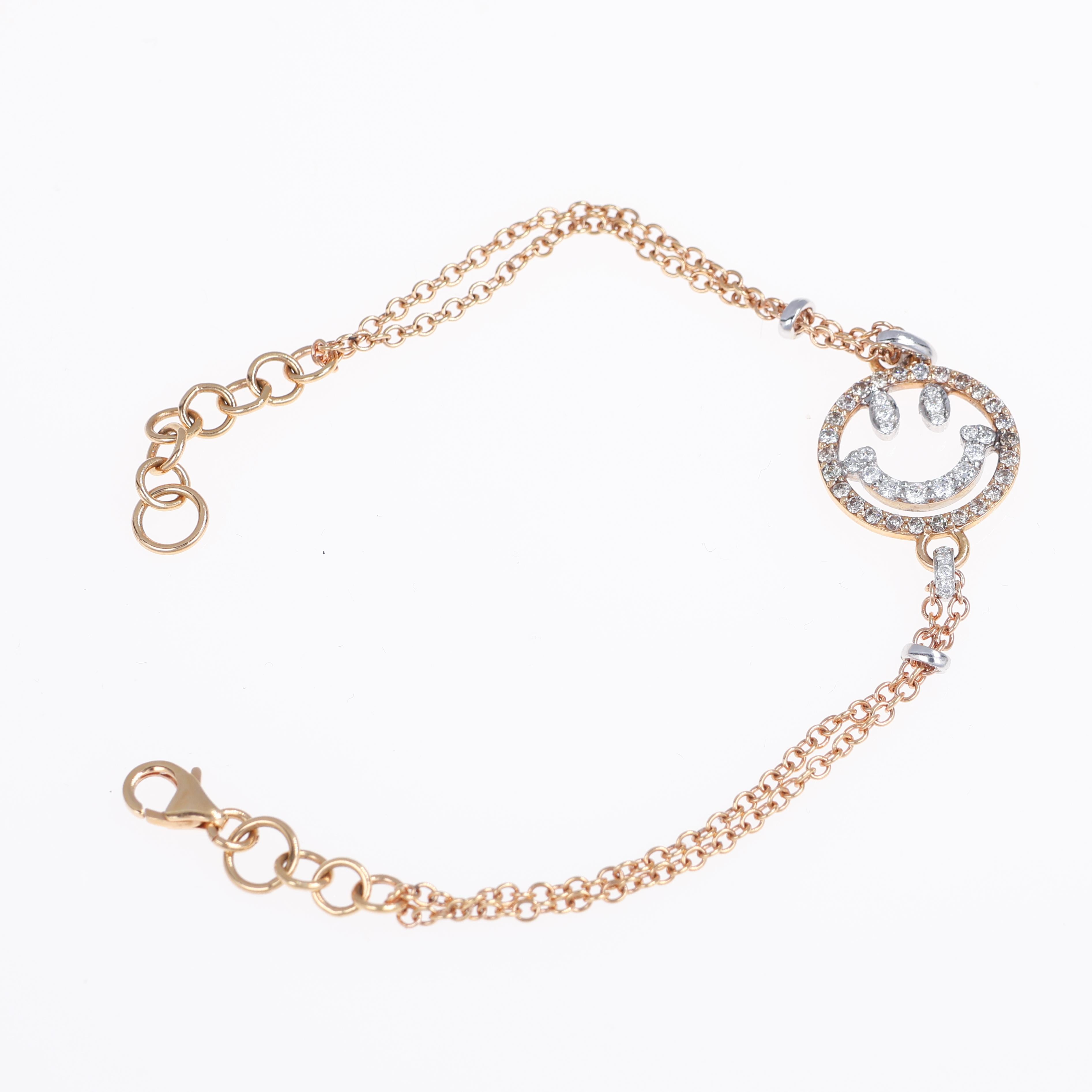 A playful and elegant bracelet crafted in 18K rose gold, featuring a smiley face motif adorned with 0.40 carats of brown diamonds and 0.24 carats of brilliant-cut white diamonds. The contrast between the warm gold and the shimmering diamonds creates