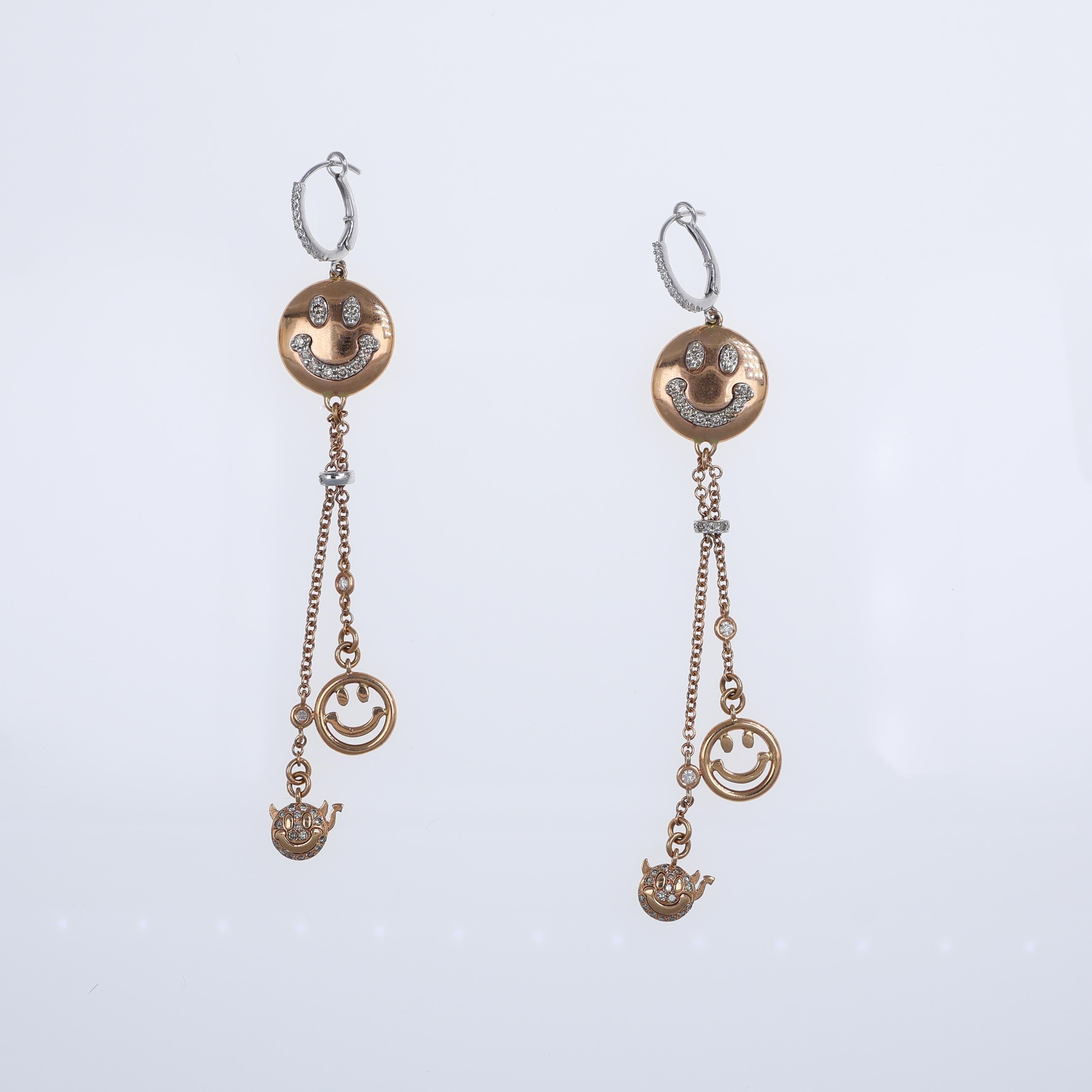 A playful and elegant pair of drop earrings crafted in 18K rose gold, featuring a smiley face motif adorned with sparkling white and brown diamonds. The earrings boast a total diamond weight of 0.31 carats for the white diamonds and 0.79 carats for