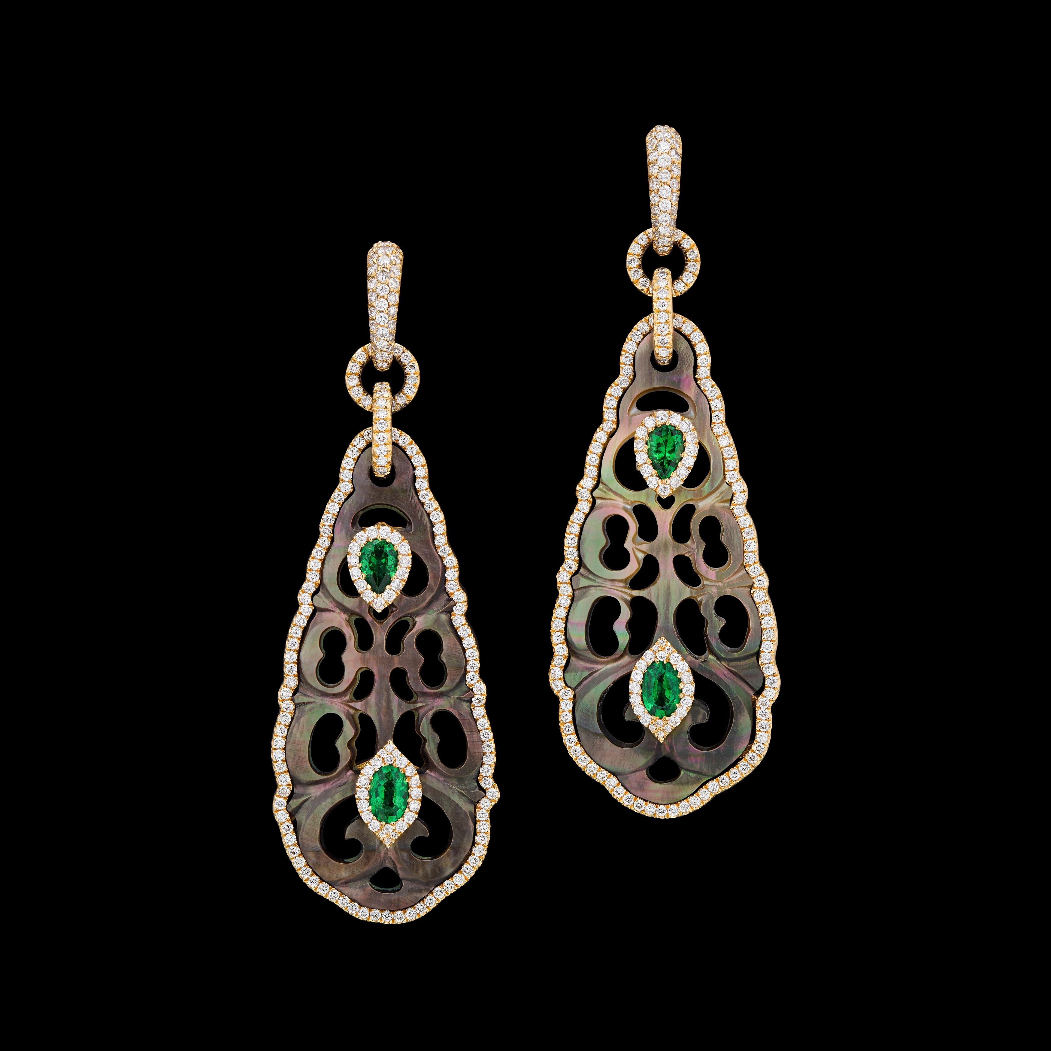 Hand carved Tahitian M.O.P with green tsavorite set in rose 18k gold with diamonds.