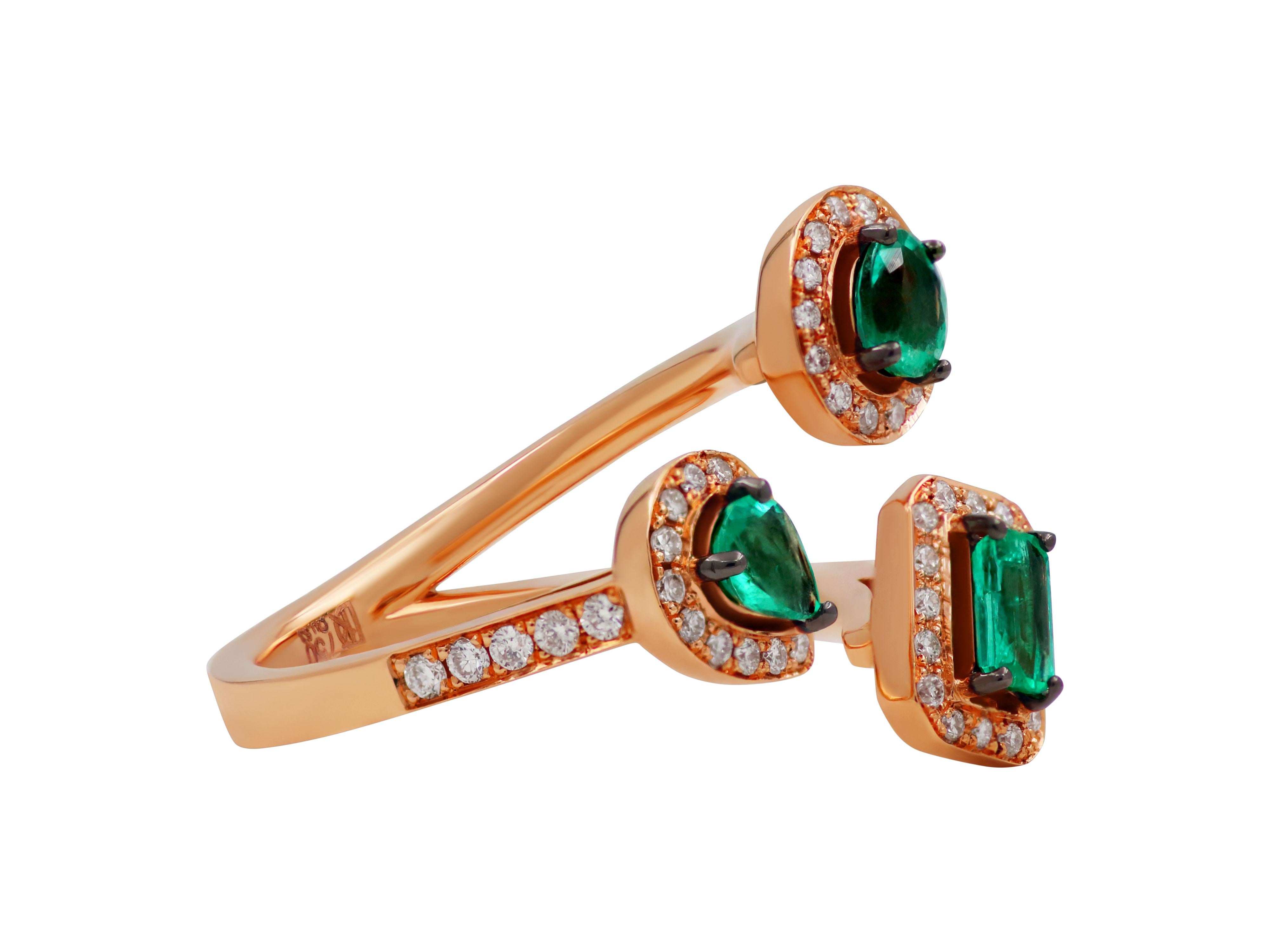 Triple ring in 18k rose gold with three 0.69 carats emeralds in different shapes and 0.37 carats brilliant cut diamonds. 

Ring face: 0.708X0.708”, 1.8X1.8cm