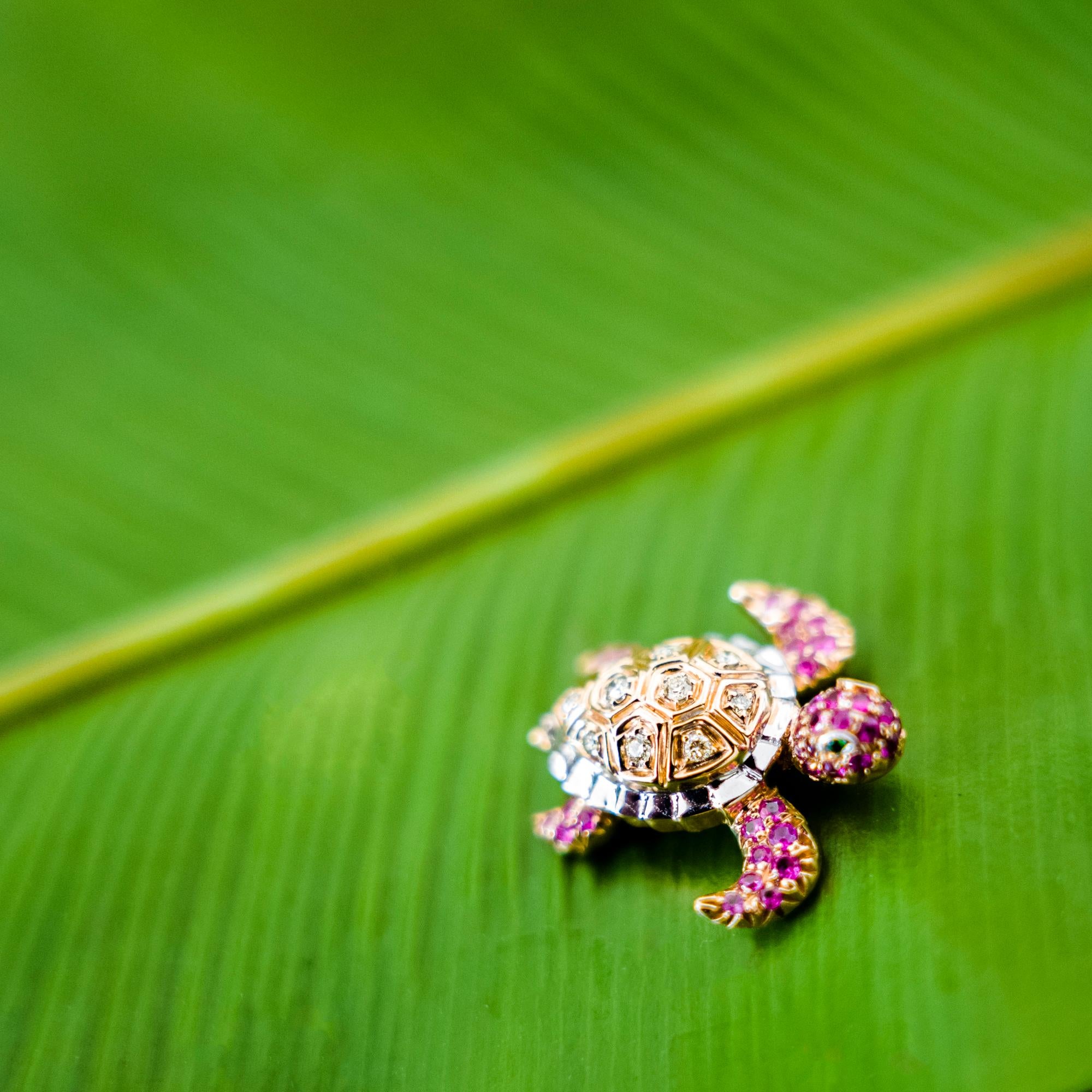 18K Rose Gold Turtle Mixed Diamond and Pink Sapphire Brooch

10 Mixed Colored Diamonds - 0.08 CT
2 Green Garnets - 0.01 CT
23 Pink Sapphires - 0.20 CT
21 Rubies - 0.16 CT
18K Rose Gold - 3.96 GM

Turtle represents intuitive development, protection,