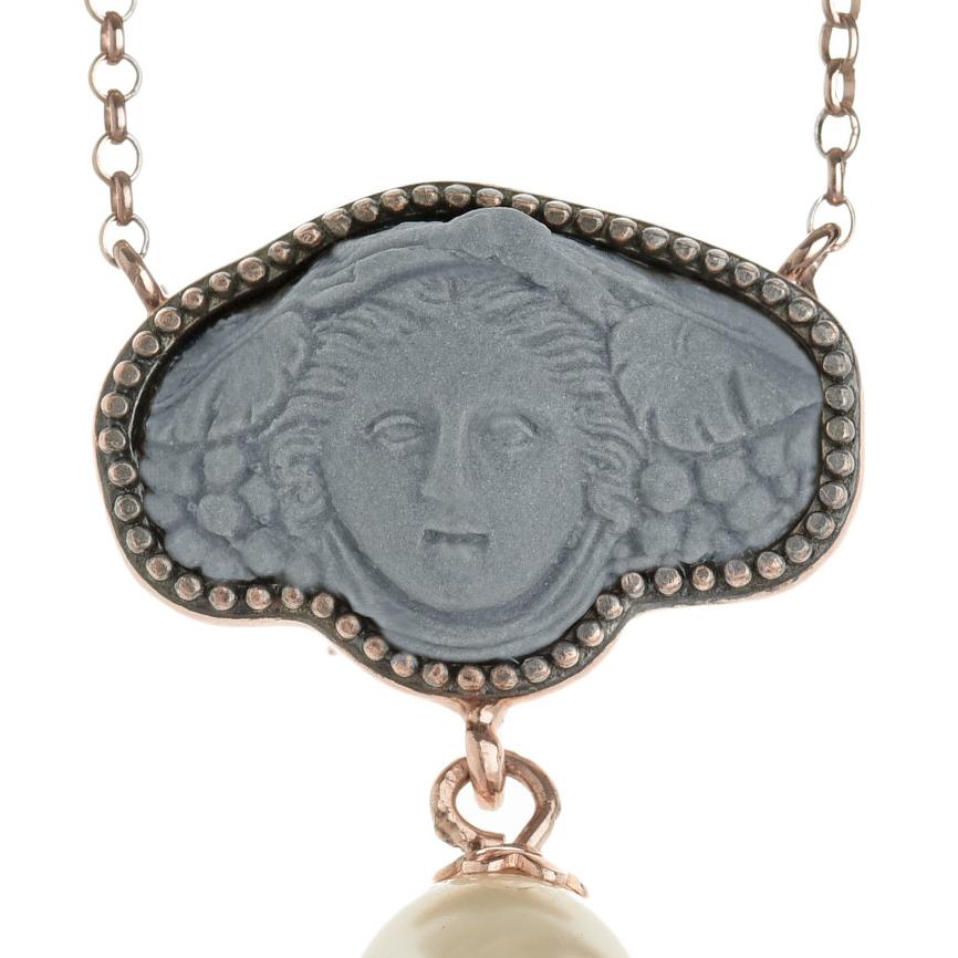 Finely detailed porcelain cameo depicting the Greek Medusa. In Greek mythology, Medusa was a gorgon, generally described as a winged human female with living venomous snakes in place of hair. The legend says that those who gazed upon her face would