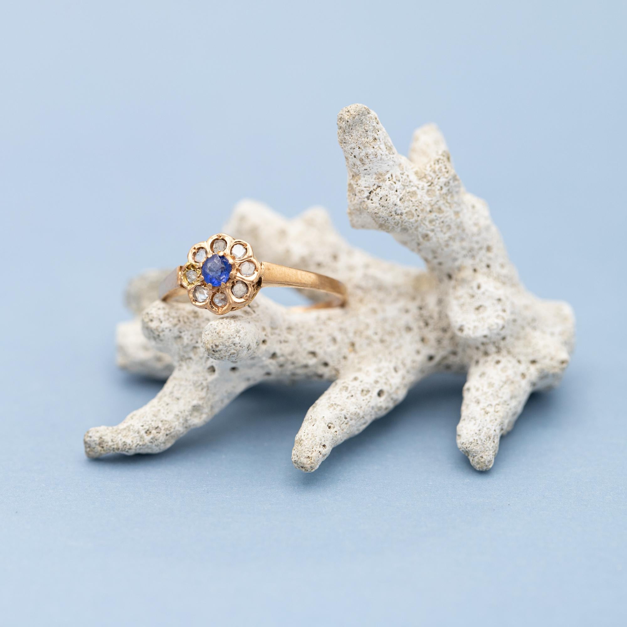 For sale is antique rose gold ring which stole our hearts the minute we laid eyes on her. This marvellous floral ring is made in 18K rose gold and set with little but romantic rose cut diamonds. These diamonds where set in the shape of a flower with