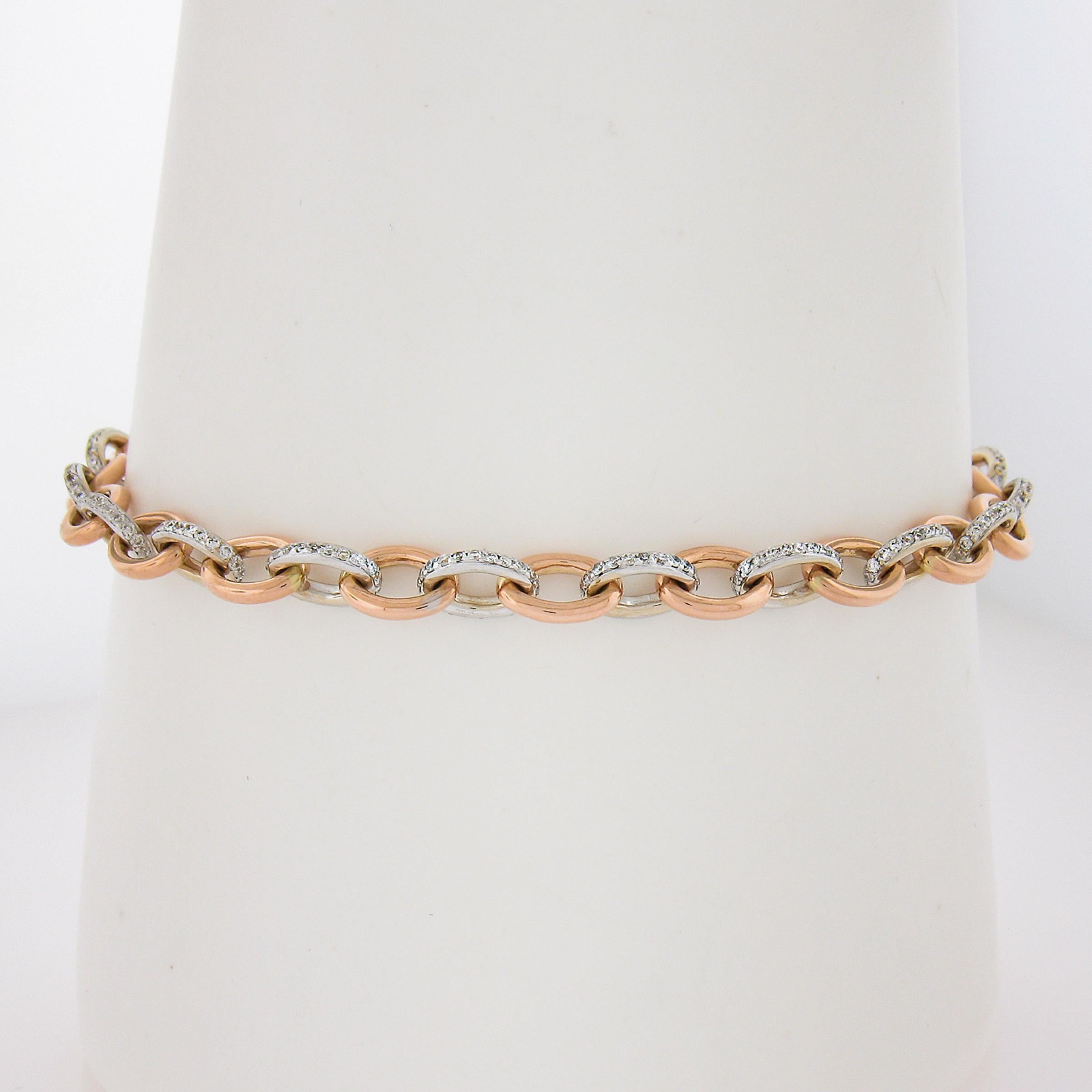 --Stone(s):--
Numerous Natural Genuine Diamonds - Round Brilliant Cut - Pave Set - G-I Color - VS2-SI2 Clarity - 0.75-1.0ctw (approx.)

Material: Solid 18k Rose & White Gold
Weight: 11.92 Grams
Chain Type: Open Oval Links
Chain Length:	Measures 7.25