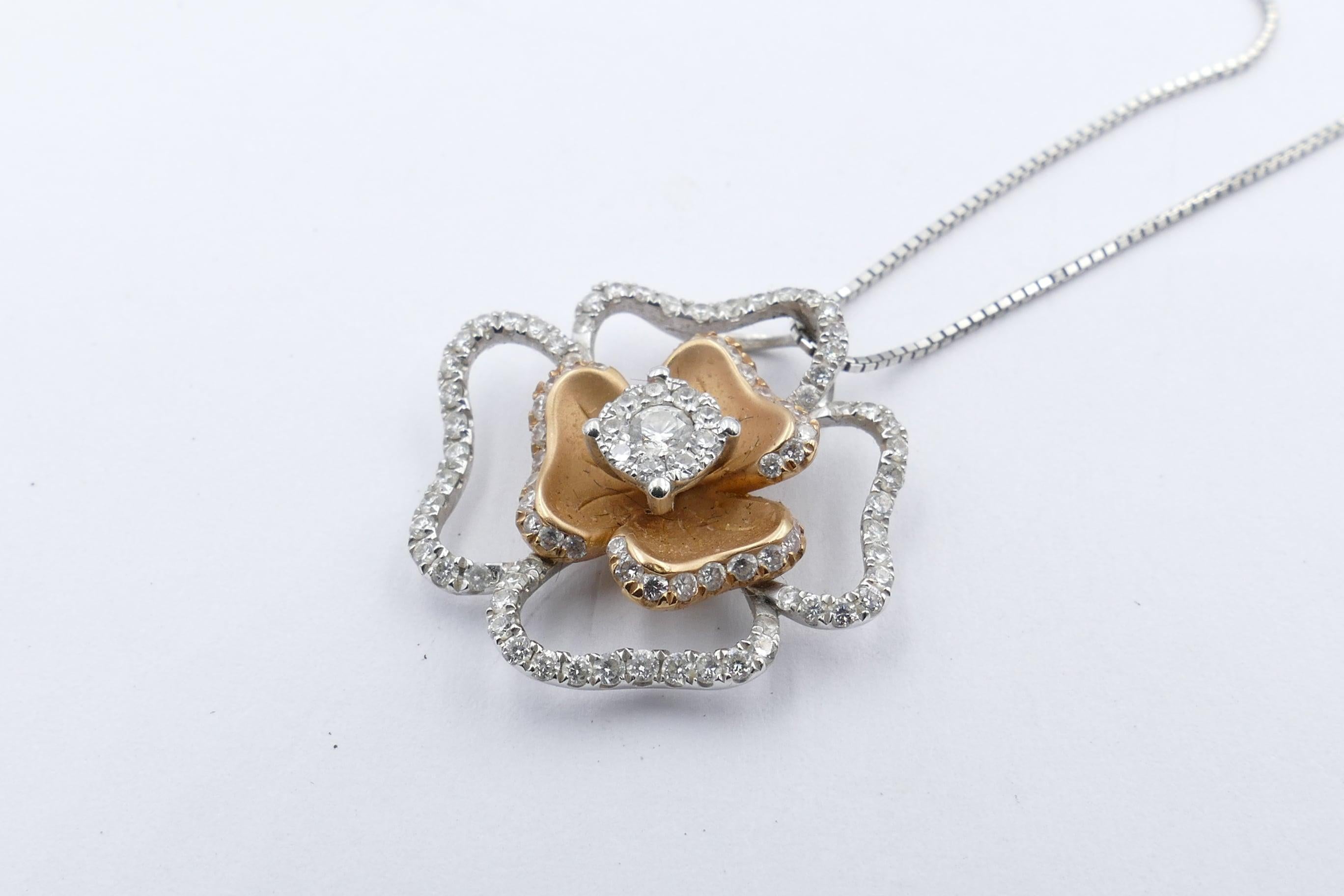 102 high quality Diamonds make up this very wearable Flower Pendant Necklace. 
Diamond grade is G with Clarity VS.
And there are just on 1 Karat of Diamonds.
Total Diamond weight 0.92K
Total Item weight 5.3 grams
Method of  Manufacture - Hand