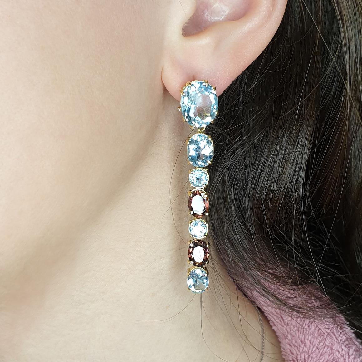 Amazing Earrings in 18k yellow gold with blue Topaz (oval cut, size: mm) pink Tourmaline (oval cut, size: mm)  g.15,50 by Stanoppi Jewellery since 1948


All Stanoppi Jewelry is new and has never been previously owned or worn. Each item will arrive