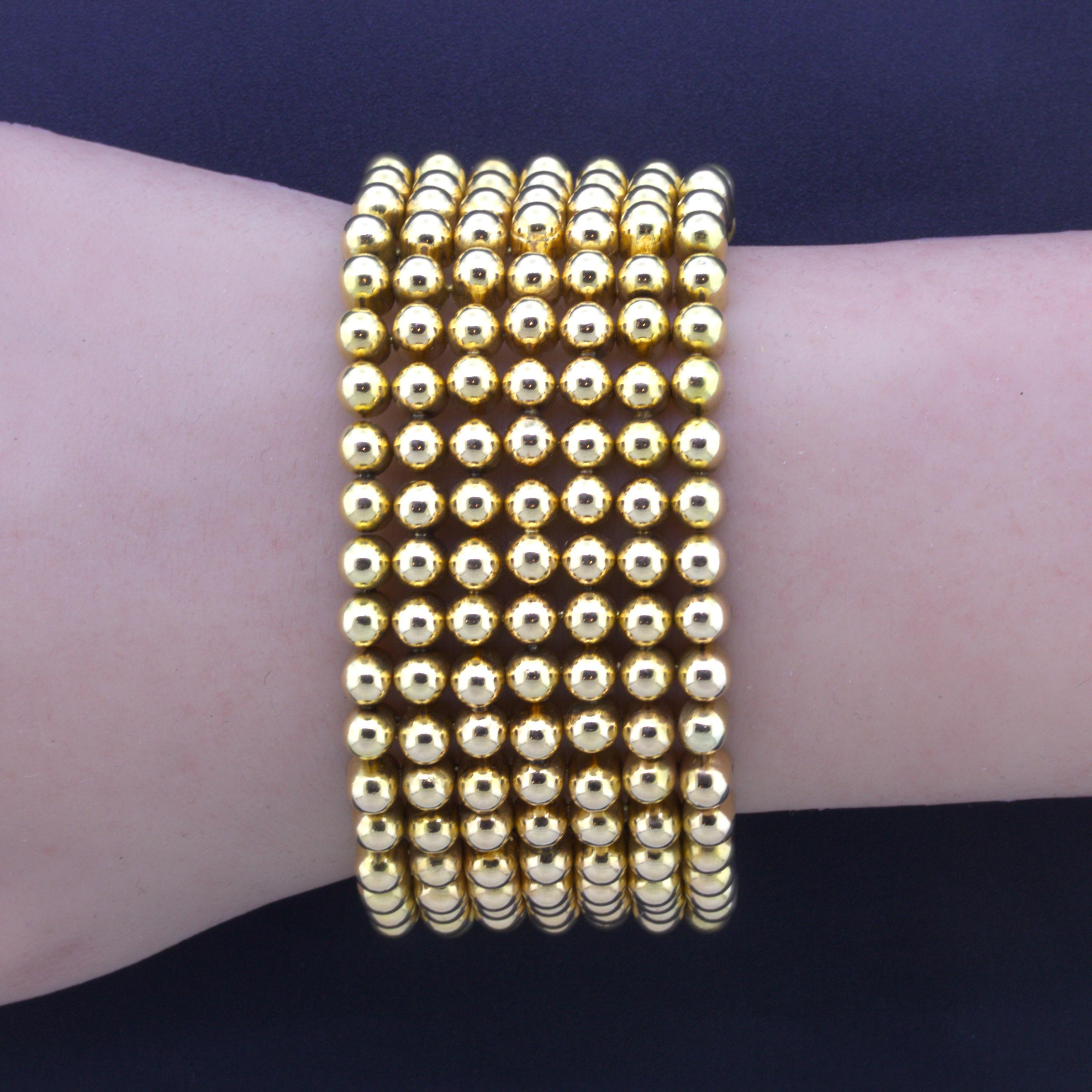 A stylish 18k gold bracelet made in the 1960’s. It is designed as 7 rows of domed beads set by each other giving the piece a unique look. Completed with clasp and safety to ensure secure fit. Made in 18k gold that is between rose and yellow color.