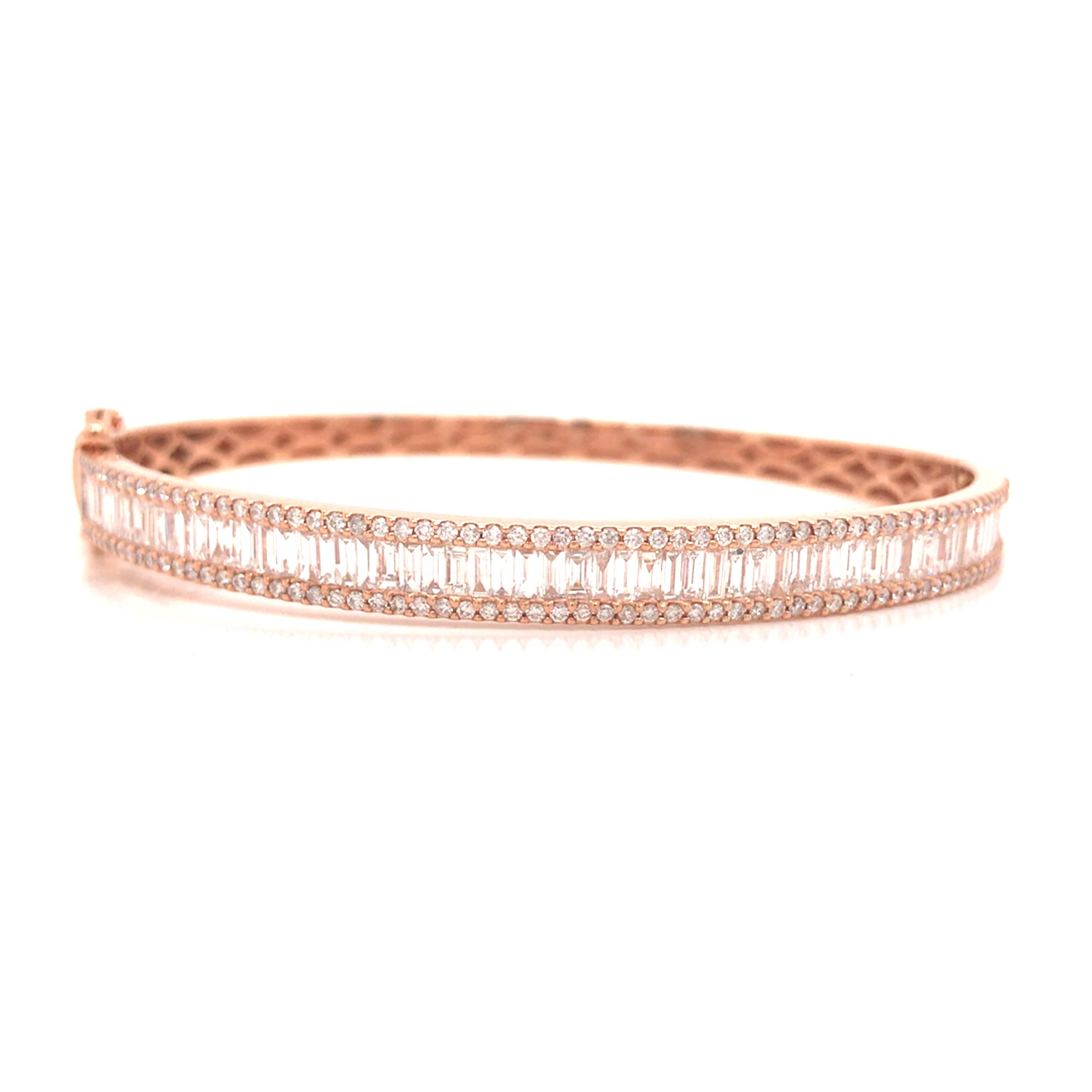 Round and Baguette Diamond Bangle in 18K Rose Gold.  Round Brilliant Cut and Baguette Diamonds weighing 2.72 carat total weight, G-H in color and VS-SI in clarity are expertly set.  The Bangle measures 6 1/2 inch and 1/4 inch in width.  14.738 grams.