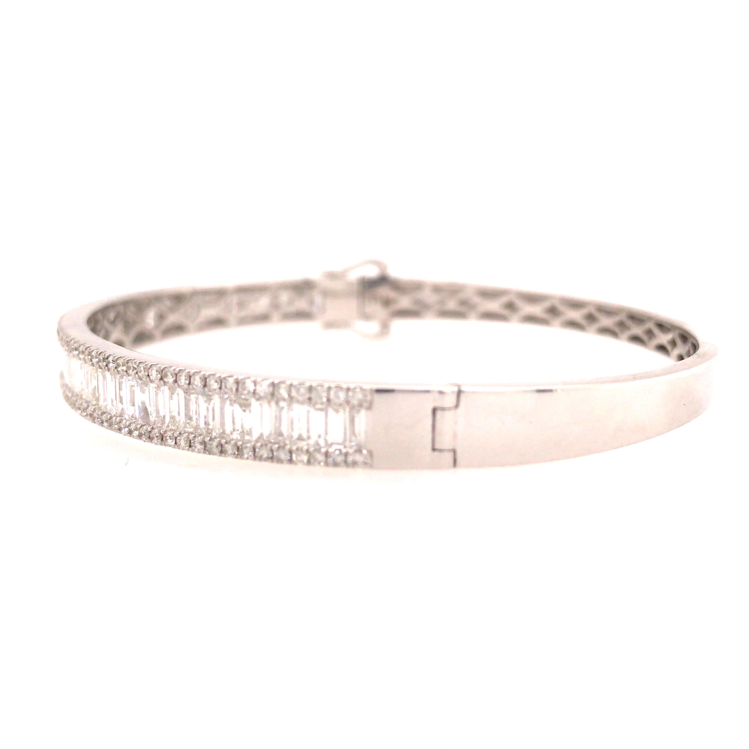 Round and Baguette Diamond Bangle in 18K White Gold.  Round Brilliant Cut and Baguette Diamonds weighing 2.75 carat total weight, G-H in color and VS-SI in clarity are expertly set.  The Bangle measures 6 1/2 inch and 1/4 inch in width.  14.8 grams.