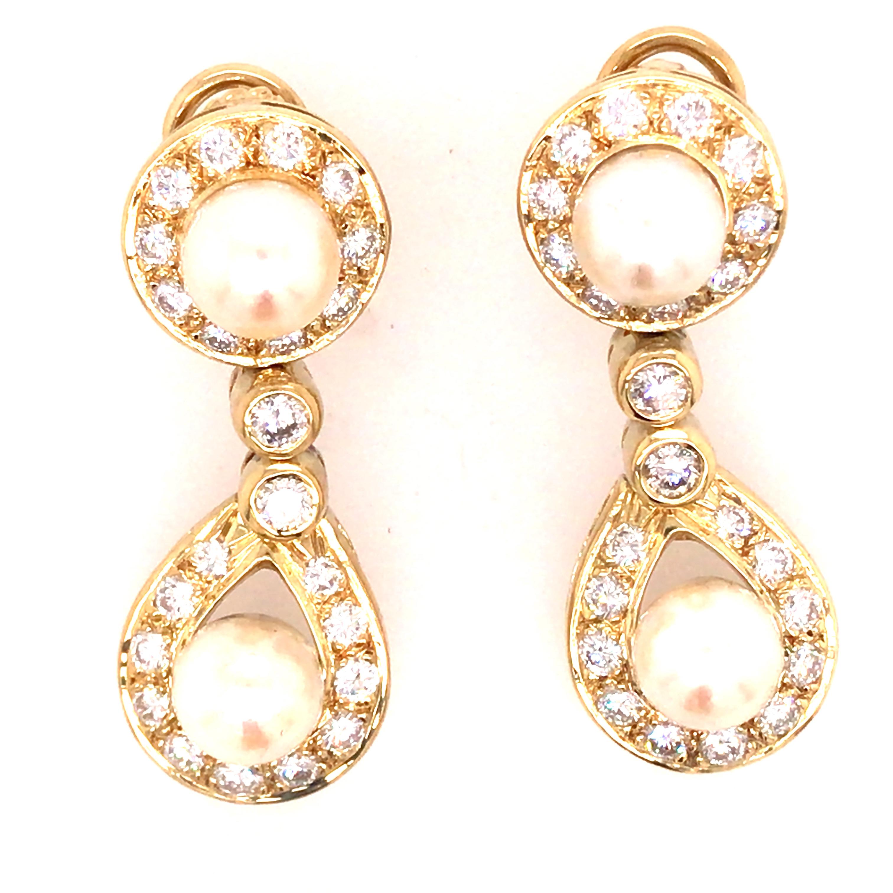 Round Diamond and Pearl Drop Earring in 18K Yellow Gold.  (46) Round Brilliant Cut Diamonds weighing approximately 2.50 carat total weight, G-H in color and VS-SI in clarity are expertly set.  The earrings measure 1 1/2 inch in length and 5/8 in