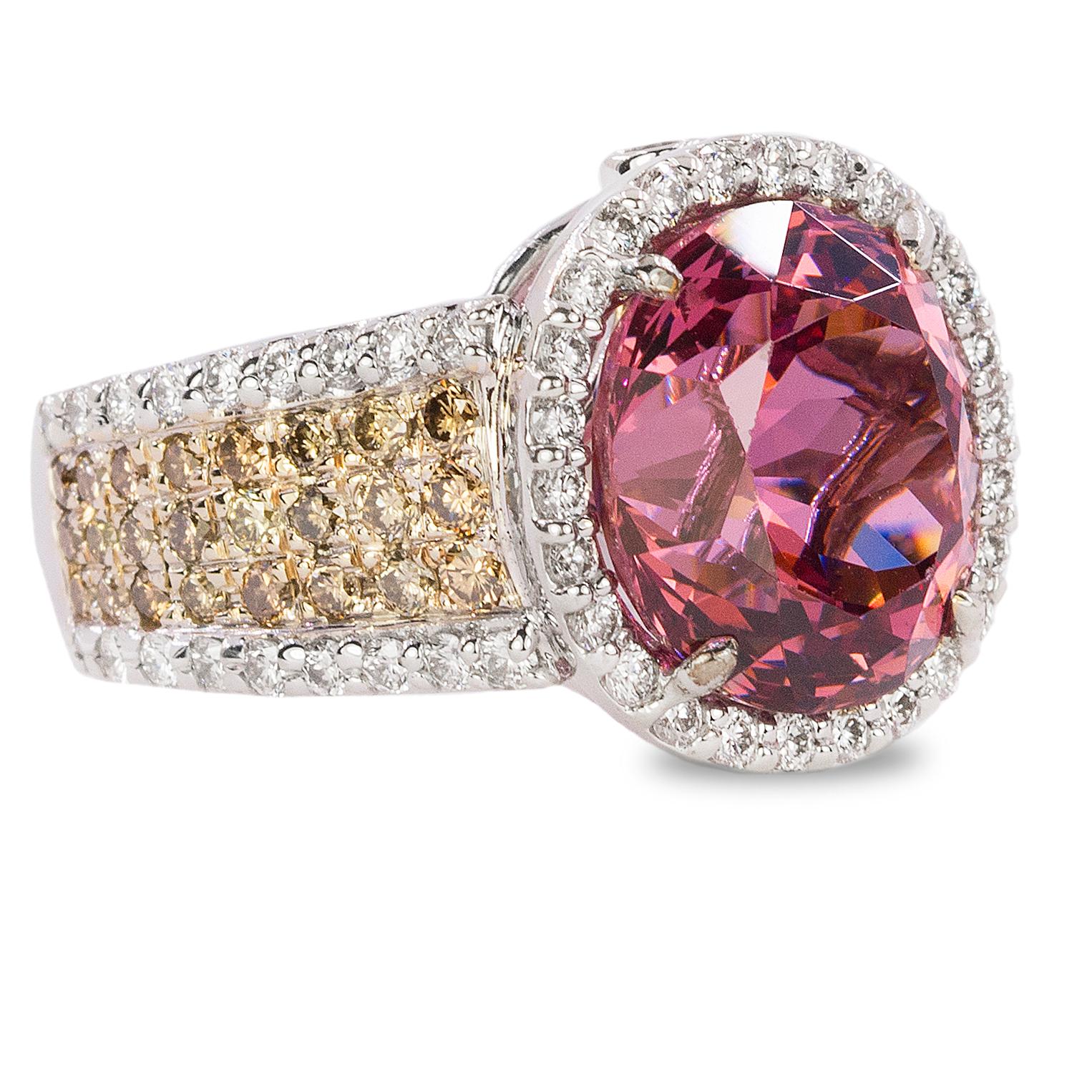 18k Ring with 7.03 carat Rubellite Tourmaline and approximately 2.00 carat of white and champagn around brilliant diamonds.
