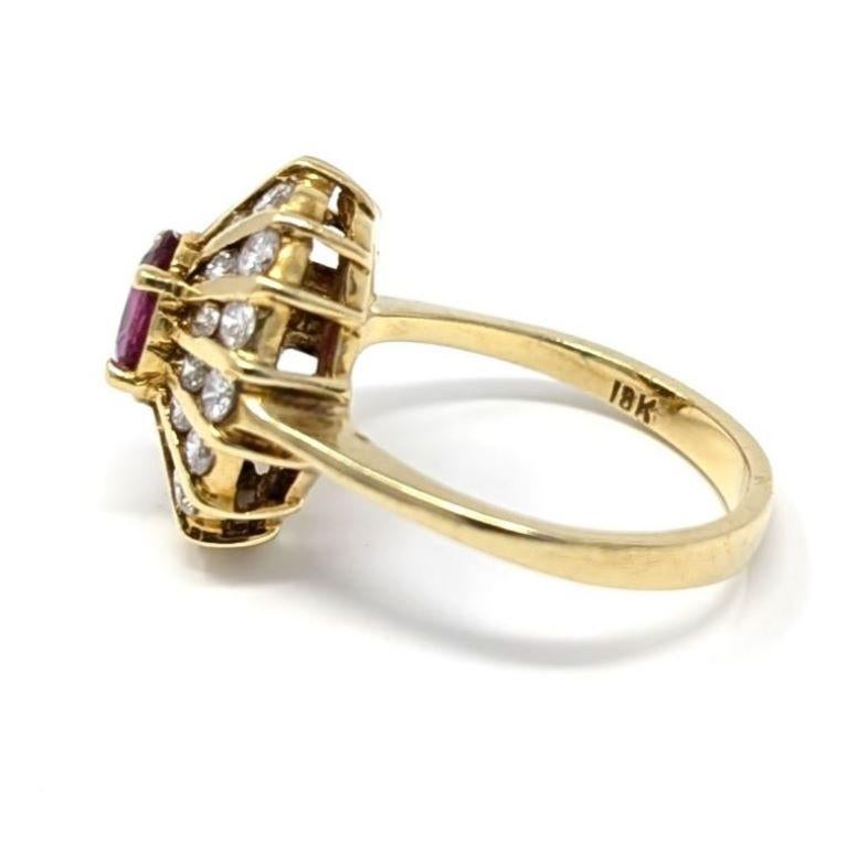Brilliant ruby and diamond ring set in 18k solid yellow gold, features a stunning starburst design. Stamped 18K on the interior of the band, best fits a US size 6.25 finger. The centerpiece measures .5 inch in width by .6 inch in length, the band