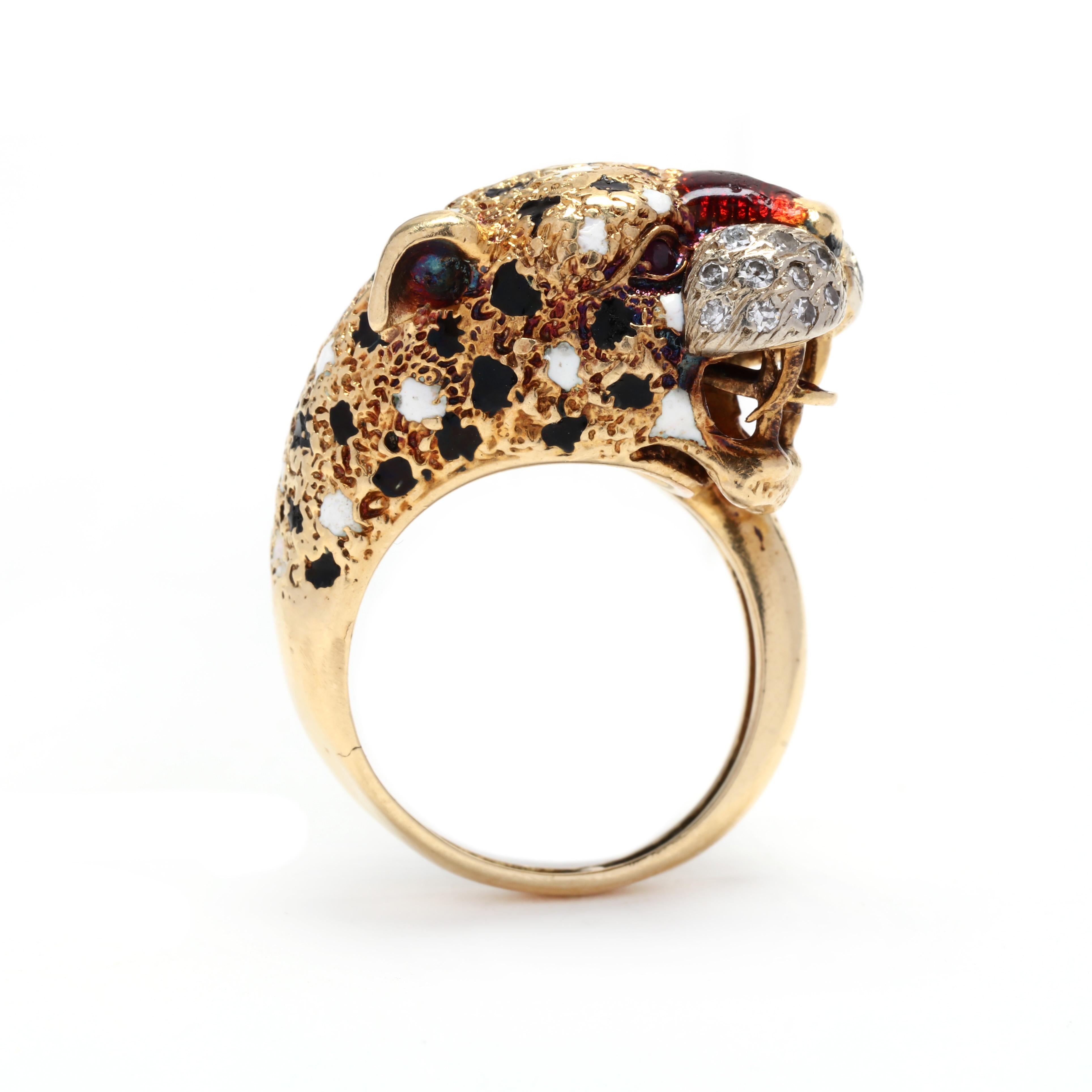 A vintage 18 karat yellow gold and gem-set cheetah ring. This ring features a cheetah head motif with black and white enamel detailing, set with single cut diamonds for whiskers and ruby eyes. A unique ring that will stand the test of