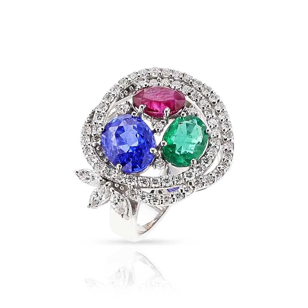 A Ruby, Emerald, Sapphire and Diamond Cocktail Ring made in 18k White Gold. The Oval Sapphire weighs appx. 2 carats, oval emerald appx. 0.20 cts. and ruby appx 1.20 carats. accented by round brilliant and marquise cut diamonds. The total weight of