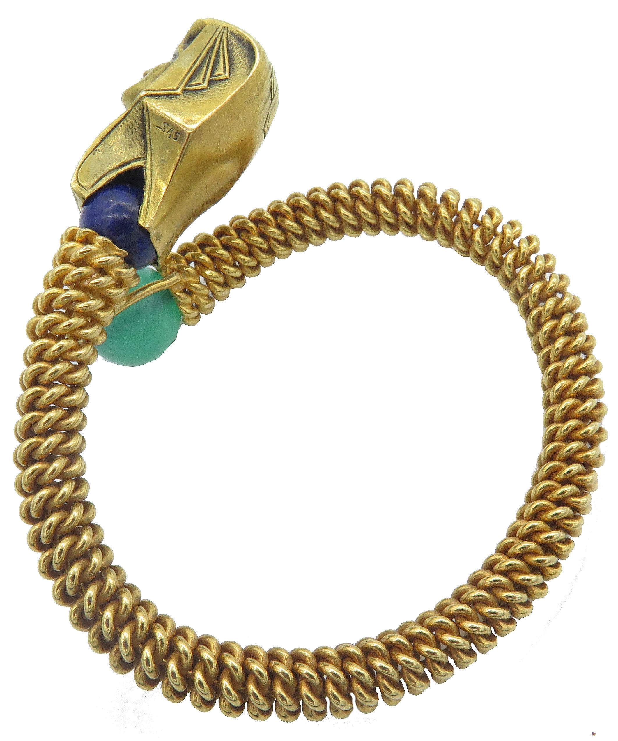 The Egyptians were leaders in manufacturing jewelry like this bold and beautiful 18k Yellow Gold Egyptian Bracelet, symbolic of the Pharaohs of Ancient Egypt. The head of the Pharaoh is mounted on a semiprecious lapis stone and enamel stripes add
