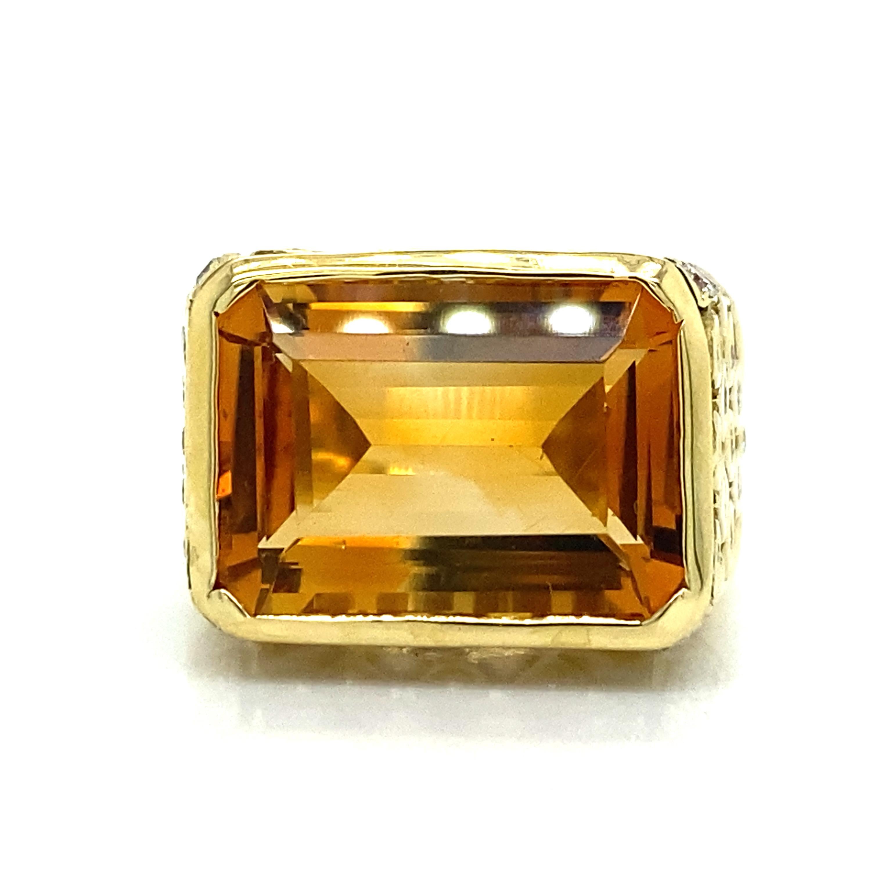 Seidengang Topaz Diamond Signet Ring in 18K Yellow Gold.  A rectangular Topaz weighing 14 carats is expertly Bezel set with Round Brilliant Cut Diamonds weighing 1.03 carat total weight G-H in color and VS in clarity are expertly set.  The Ring