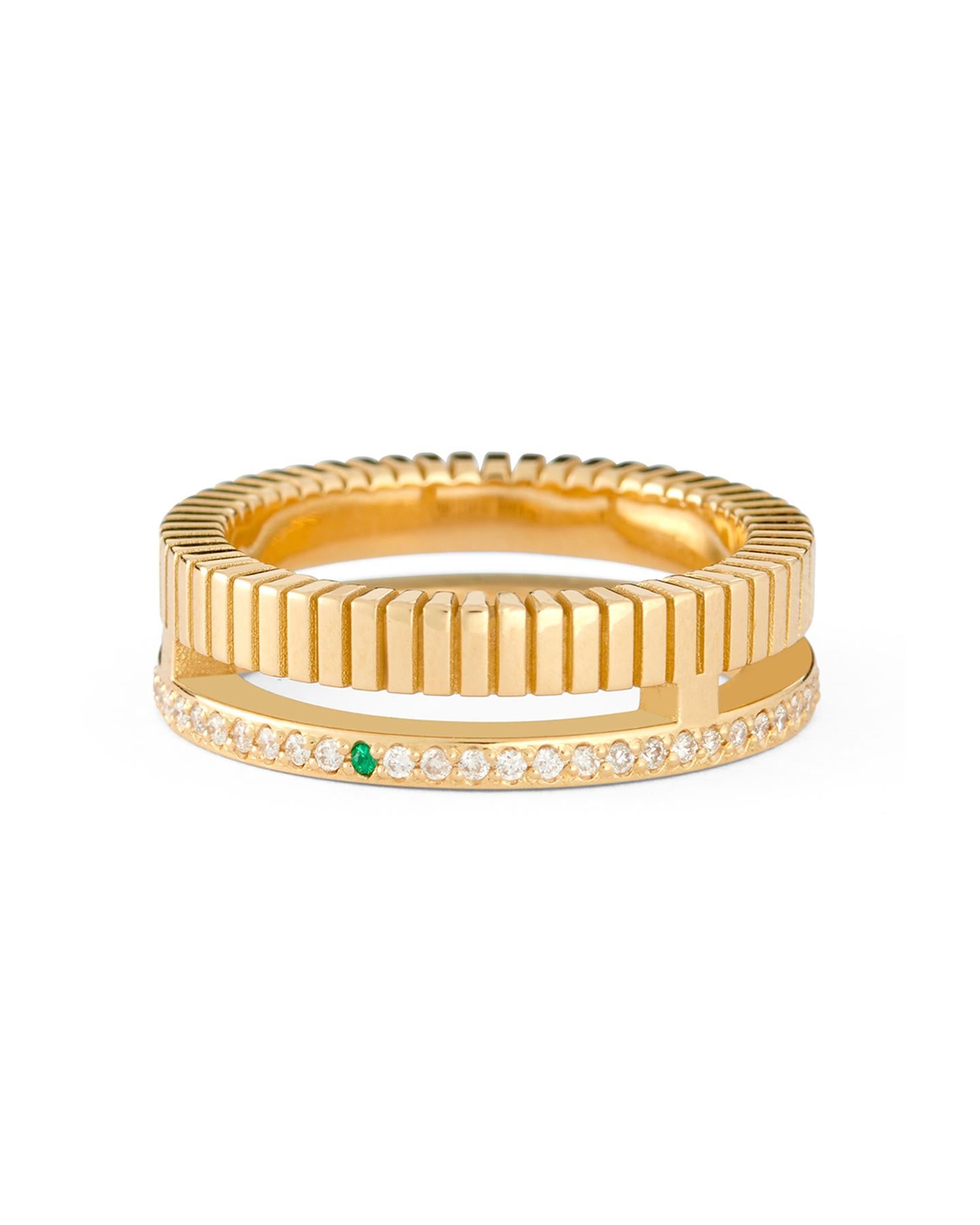 One of the brand’s original debut designs, the 18-karat gold Slim Slot ring is a foundational style. The iconic silhouette features a cutout through the center – one side is encrusted with diamonds and a single emerald, while the other features