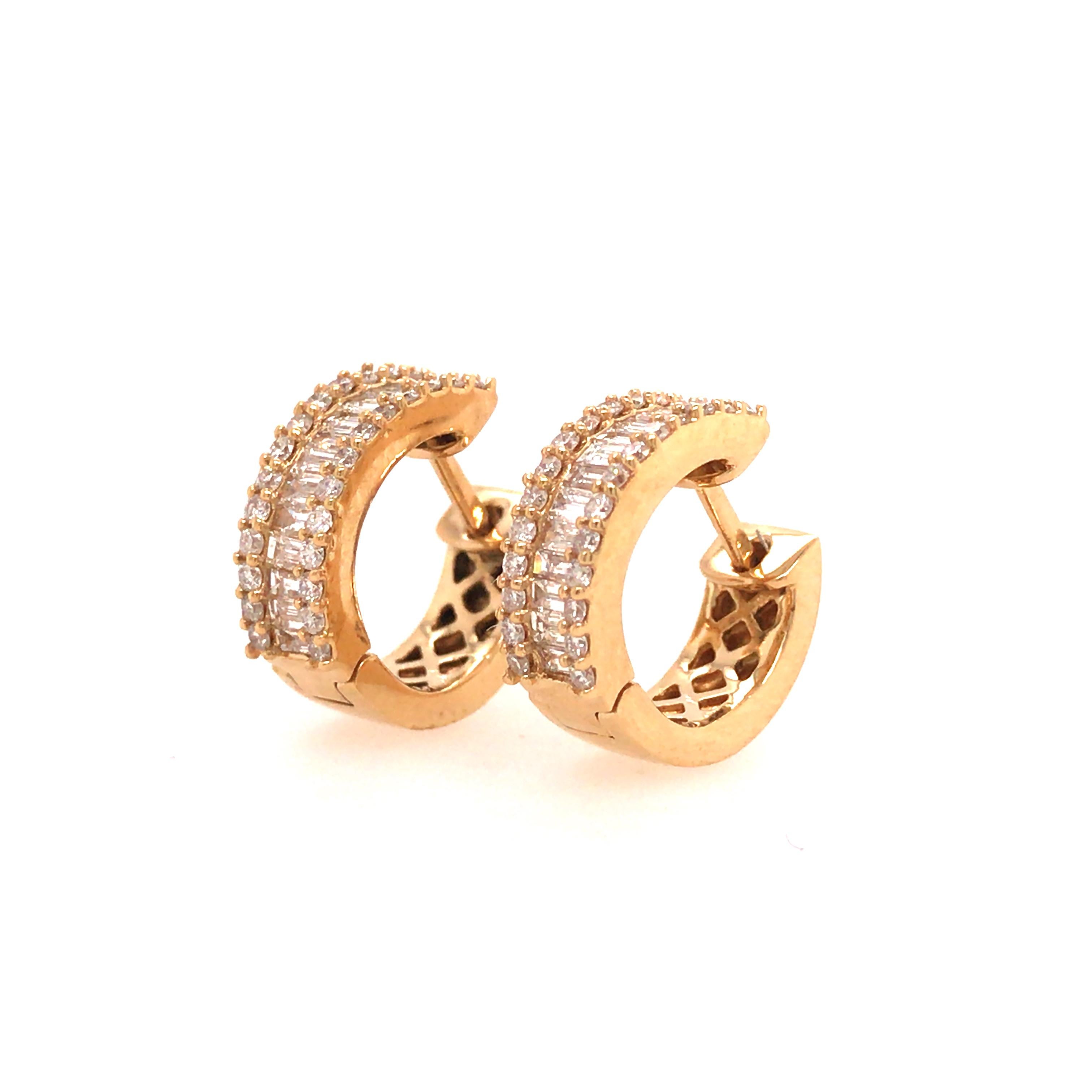 Small Diamond Huggie in 18K Yellow Gold.  (52) Round Brilliant Cut and (26) Baguette Diamonds weighing 0.66 carat total weight, G-H in color and VS in clarity are expertly set.  The Earrings measure 1/2 inch and weigh 4.2 grams.