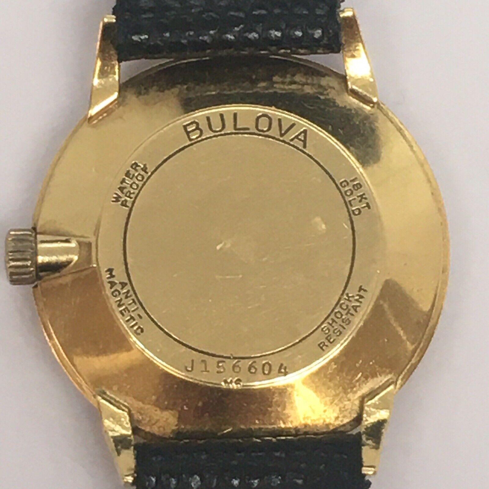 18k Solid Gold Bulova Black Dial All Original Swiss Gents Wristwatch In Good Condition For Sale In Los Angeles, CA