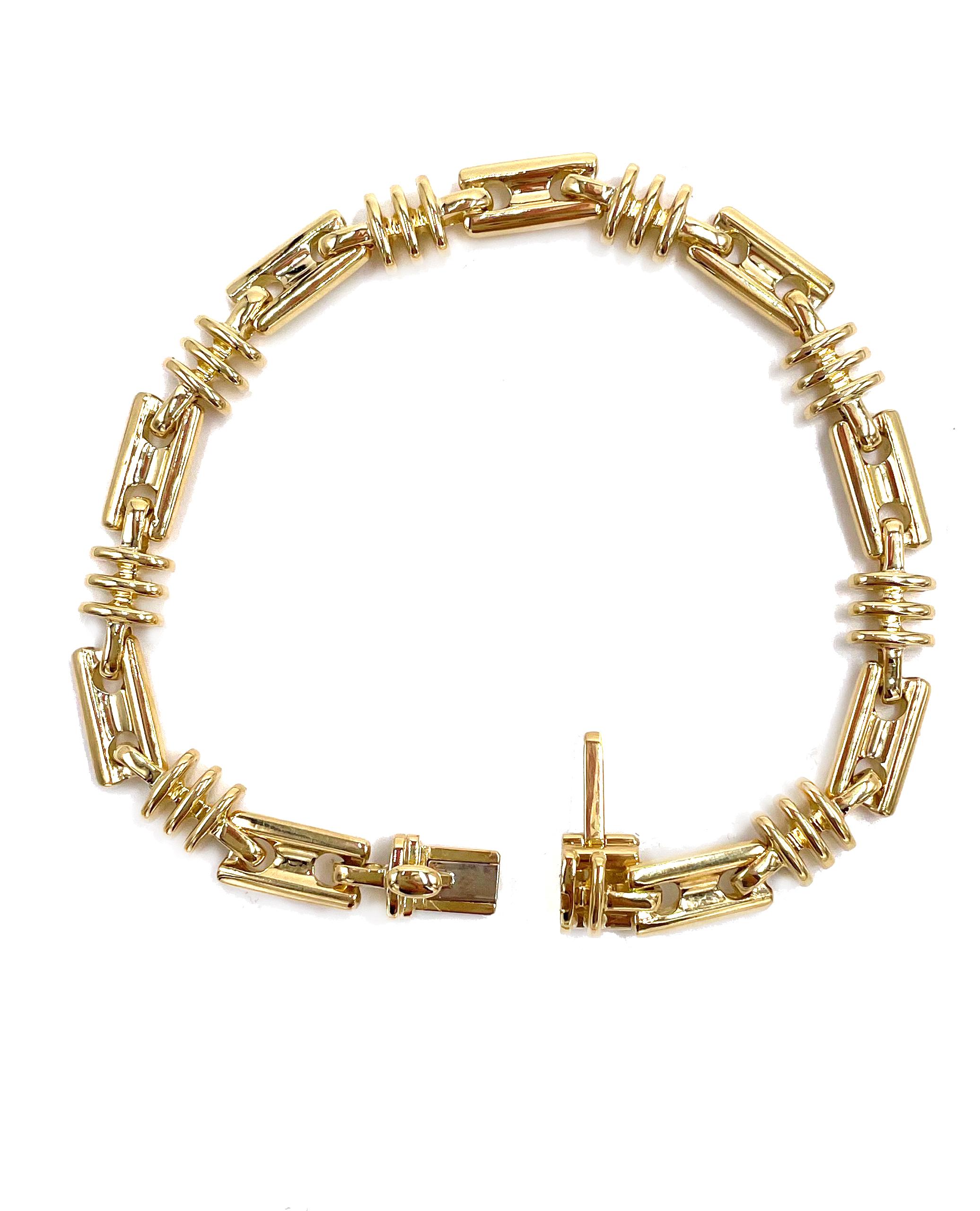 18K yellow gold solid men's bracelet with custom handmade lock and hidden safety lock. 

* 43.9 grams total weight.
* 8.75 inches long. Can be shortened.