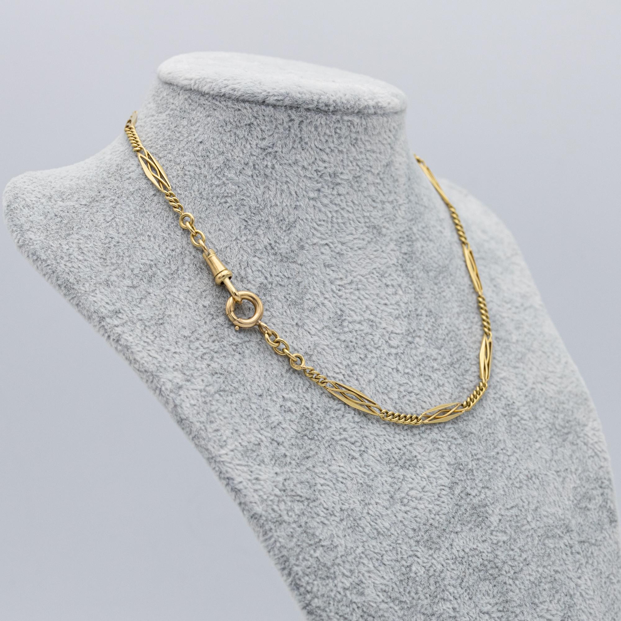 For sale is this wonderful 18 K yellow gold Albert necklace. It consists of spacial, fancy looking Lozenge links, short curb chains, an antique dog clip and a lovely bolt ring. It is fully hallmarked with all the needed French marks : eagle heads, a
