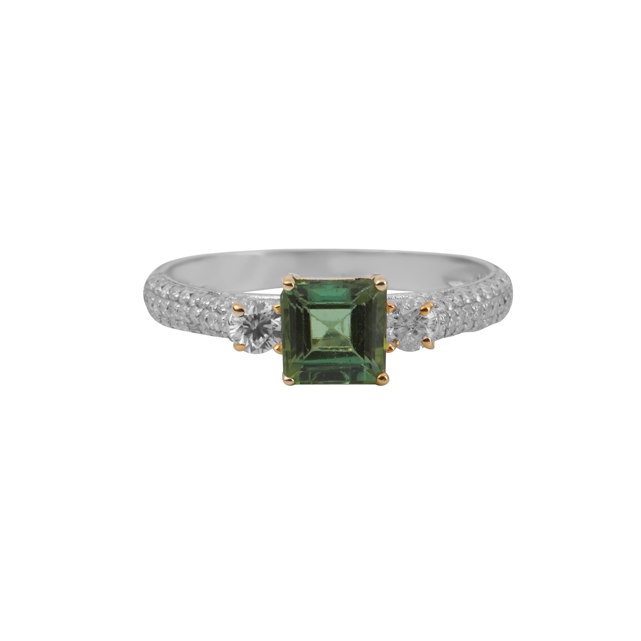 PRODUCT DETAILS:
18k Solid Gold
Stones:
Center Stone: Natural loose tourmaline 1 c.t (approx)
Side stones :Brilliant cut Moissanite 0.5 c.t (approx)

Are you looking for a stunning ring that will make you feel like a star? Look no further than the