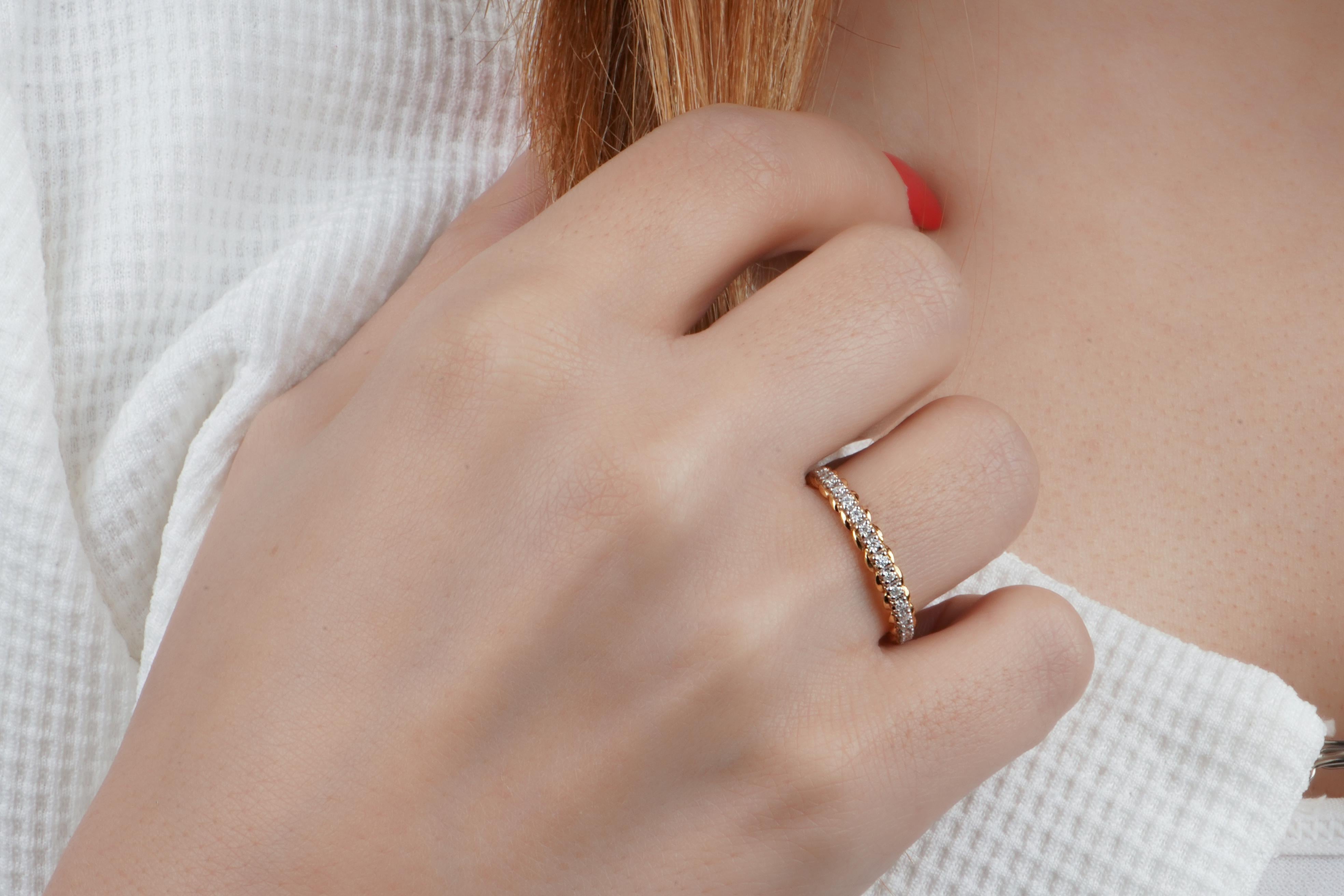 If you are looking for a stunning and unique ring to express your love, look no further than the twisted stack ring. This ring features a beautiful 18k solid gold band that twists around your finger, creating a striking contrast with the sparkling