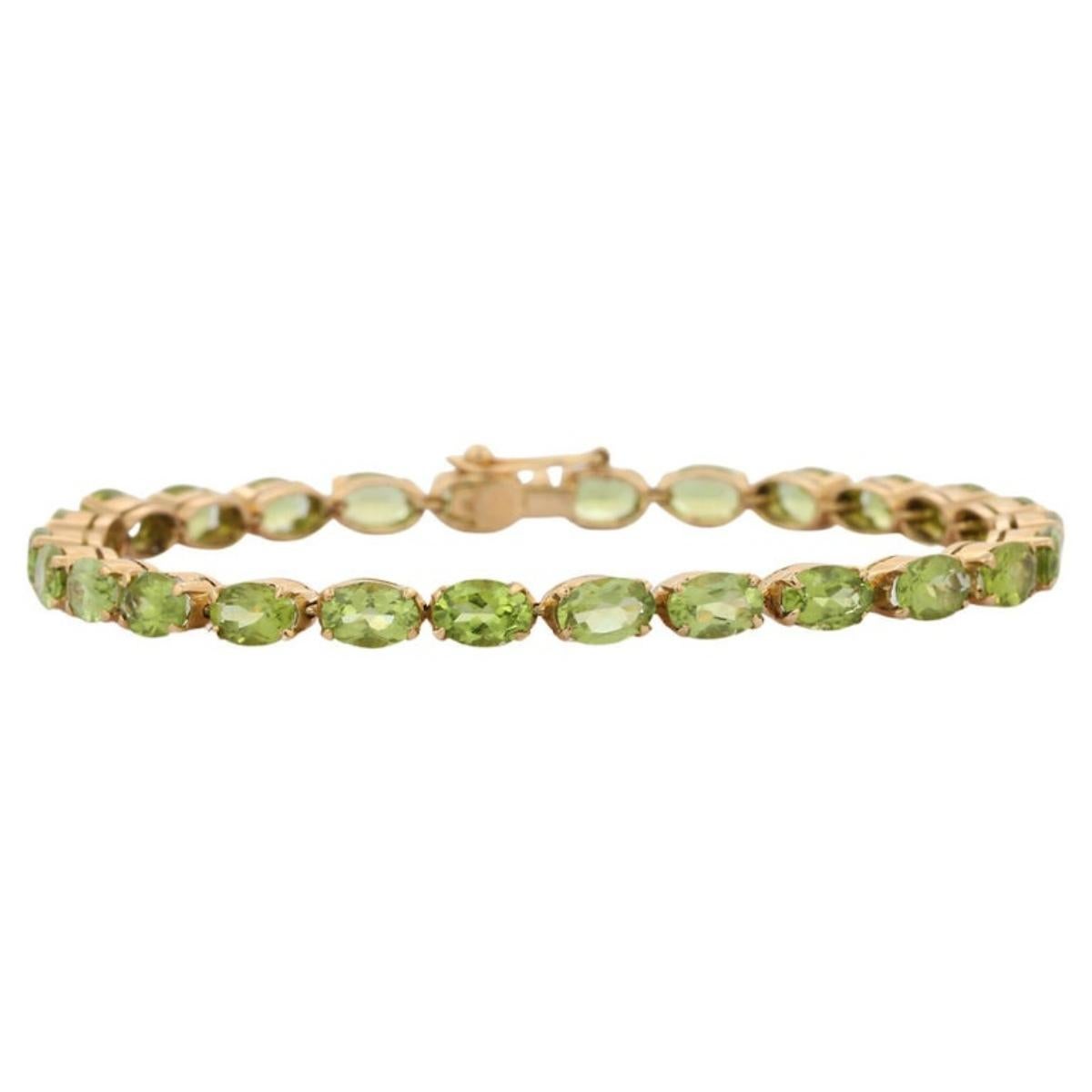 This 18k Solid Yellow Gold 18.5 CT Natural Oval Cut Peridot Tennis Bracelet showcases 26 endlessly sparkling natural peridot, weighing 18.5 carats. It measures 7.25 inches long in length. 
Peridot attracts love and calms anger by giving renewal to