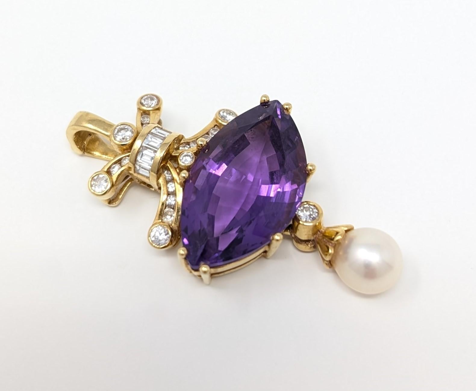 Stunning vintage 18k solid yellow gold pendant featuring a large marquise cut amethyst. Accented with dazzling diamonds and a dangle drop pearl. The pendant measures approximately .97 inch in width by 1.8 inch in length and .4 inch in depth. The