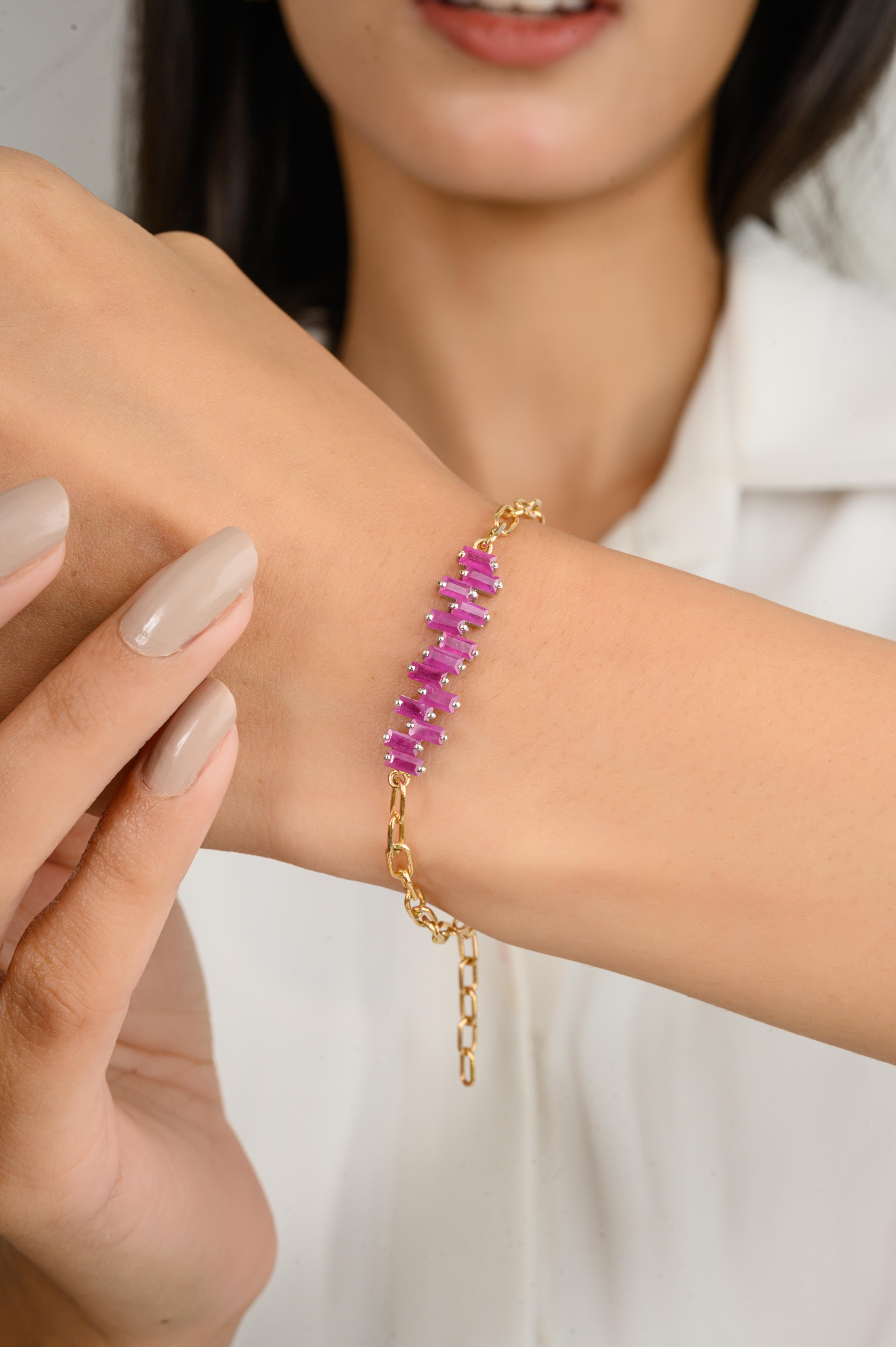 This Modern Baguette Cut Ruby Charm Bracelet in 18K gold showcases endlessly sparkling natural ruby, weighing 2.5 carats. It measures 7 inches long in length. 
Ruby improves mental strength.
Designed with perfect baguette cut ruby set in a line